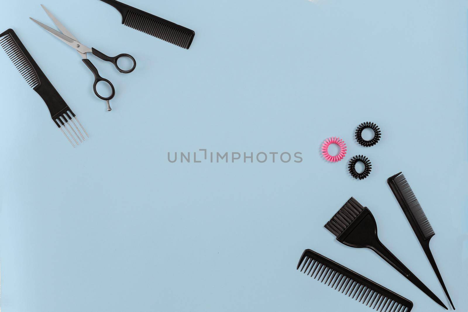 Hairdresser set with various accessories on blue background by nazarovsergey