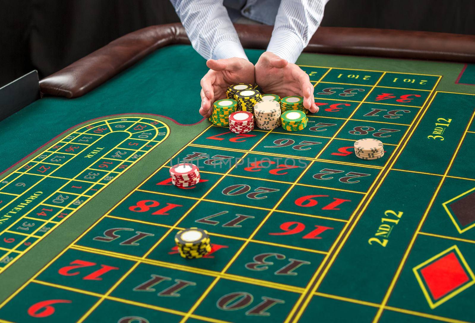 Picture of a green table and betting with chips. by nazarovsergey