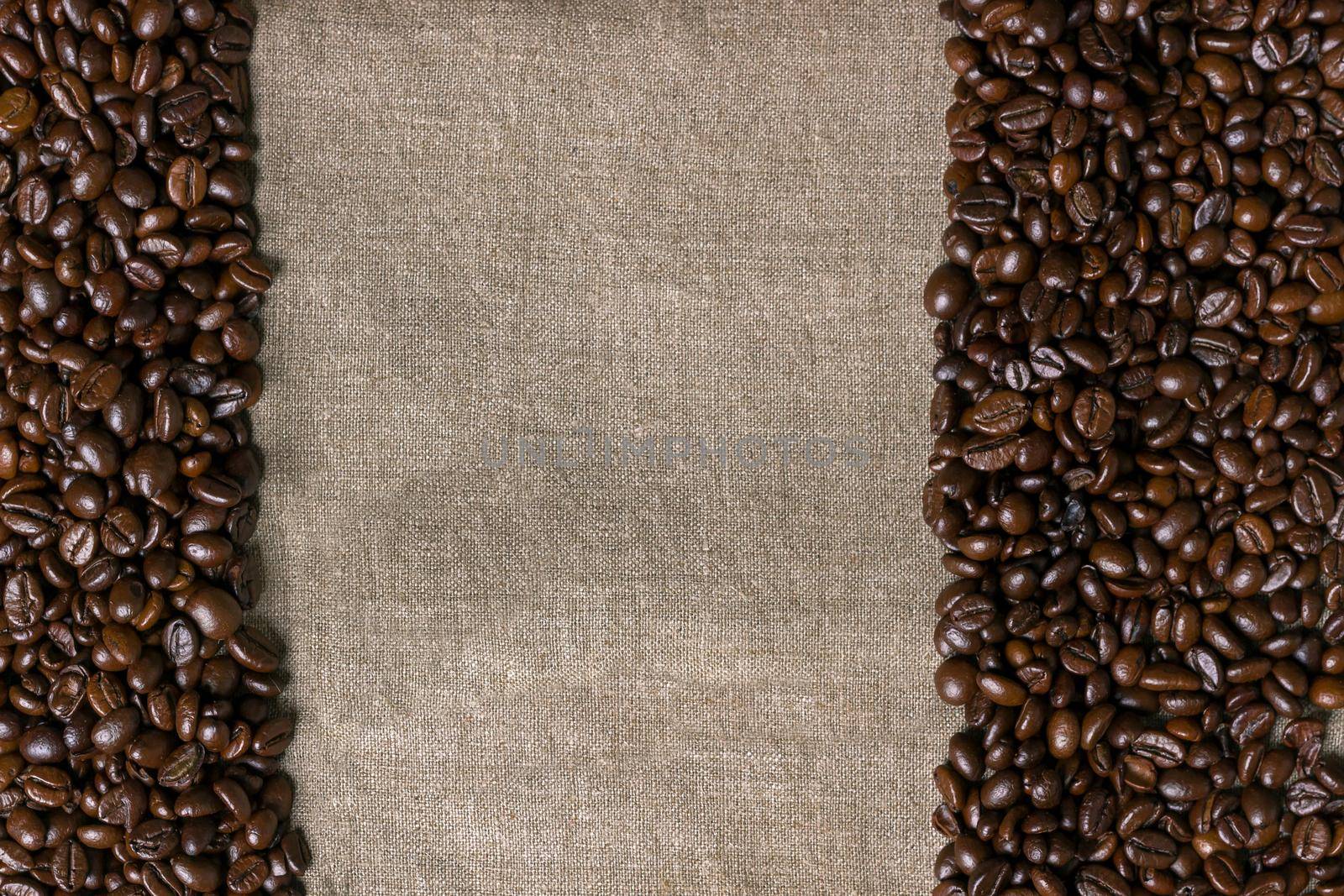 Coffee beans on burlap background. Top view. Copy space. Still life. Mock-up. Flat lay