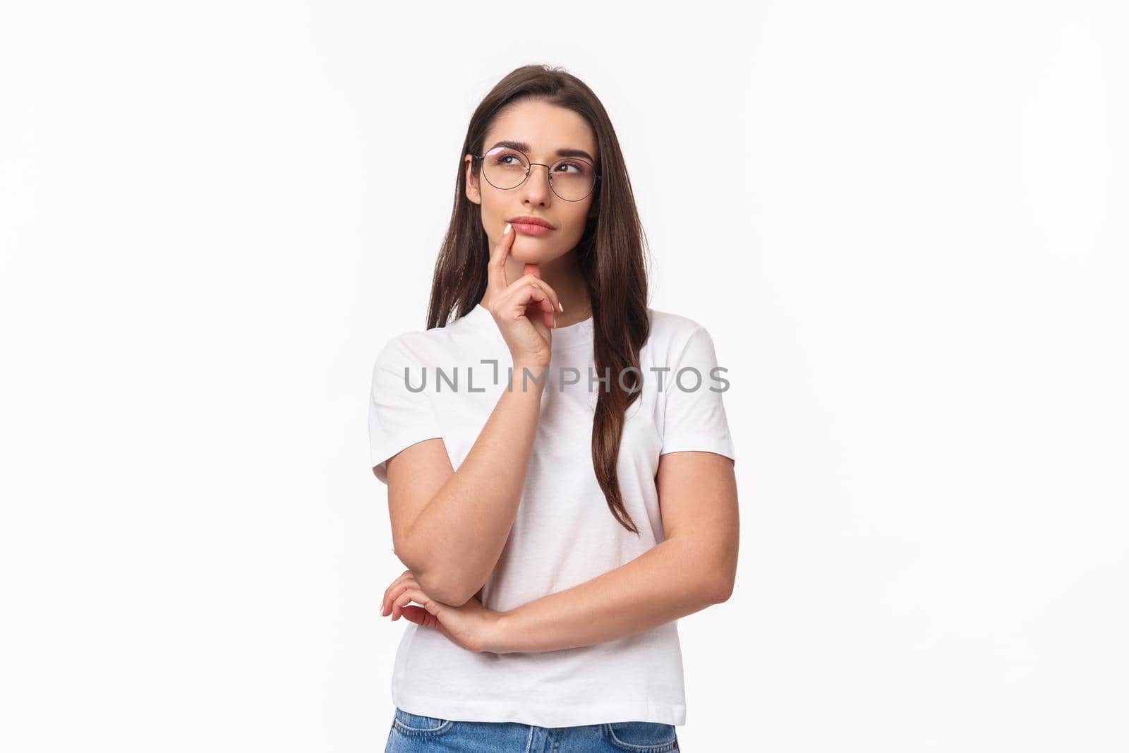 Waist-up portrait of creative pretty young woman, digital artist imaging new project, wear glasses, look up thoughtful, touch chin thinking, making plan, standing white background by Benzoix