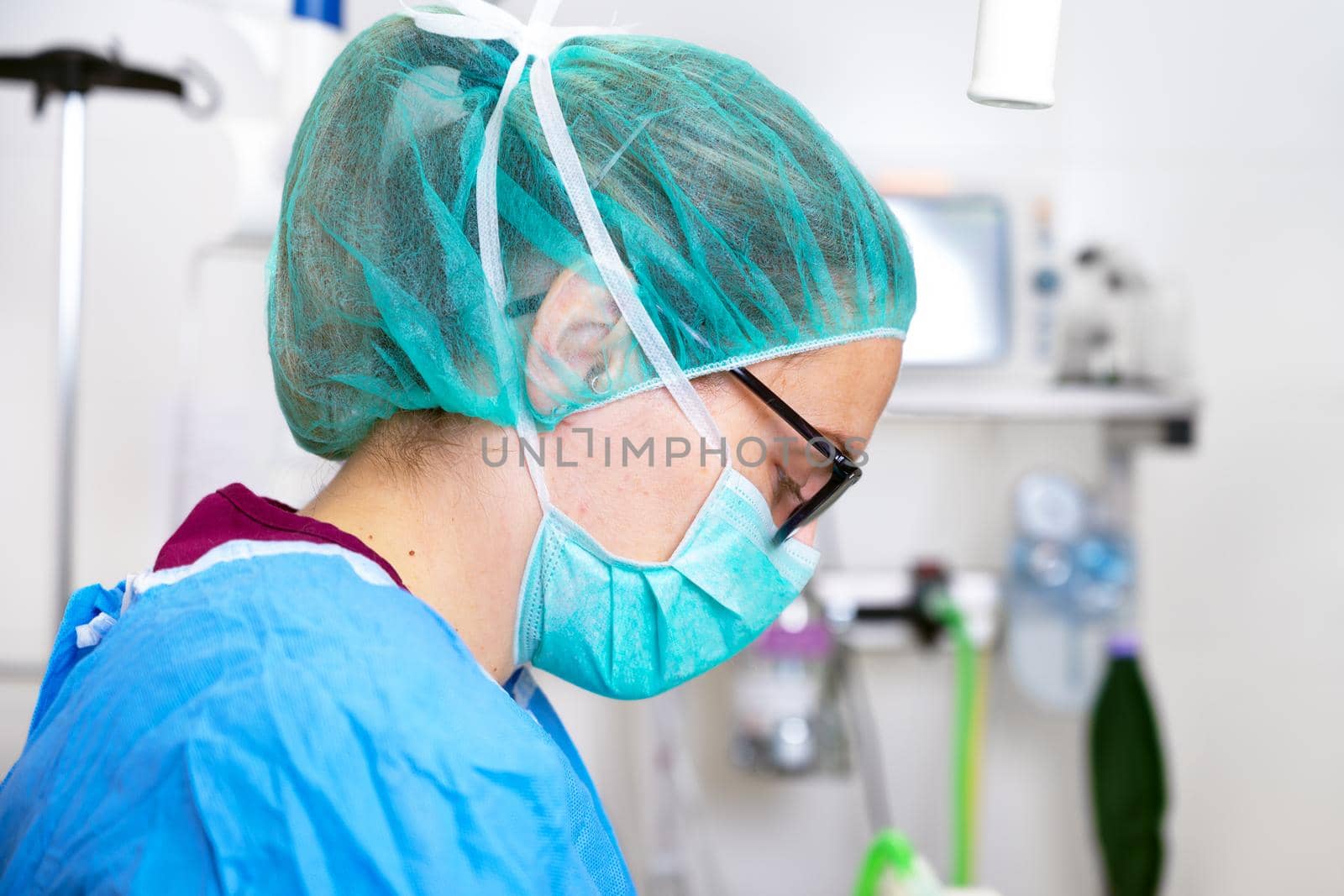 Portrait of female healthcare worker with face mask working at hospital during coronavirus pandemic outbreak. High quality photo