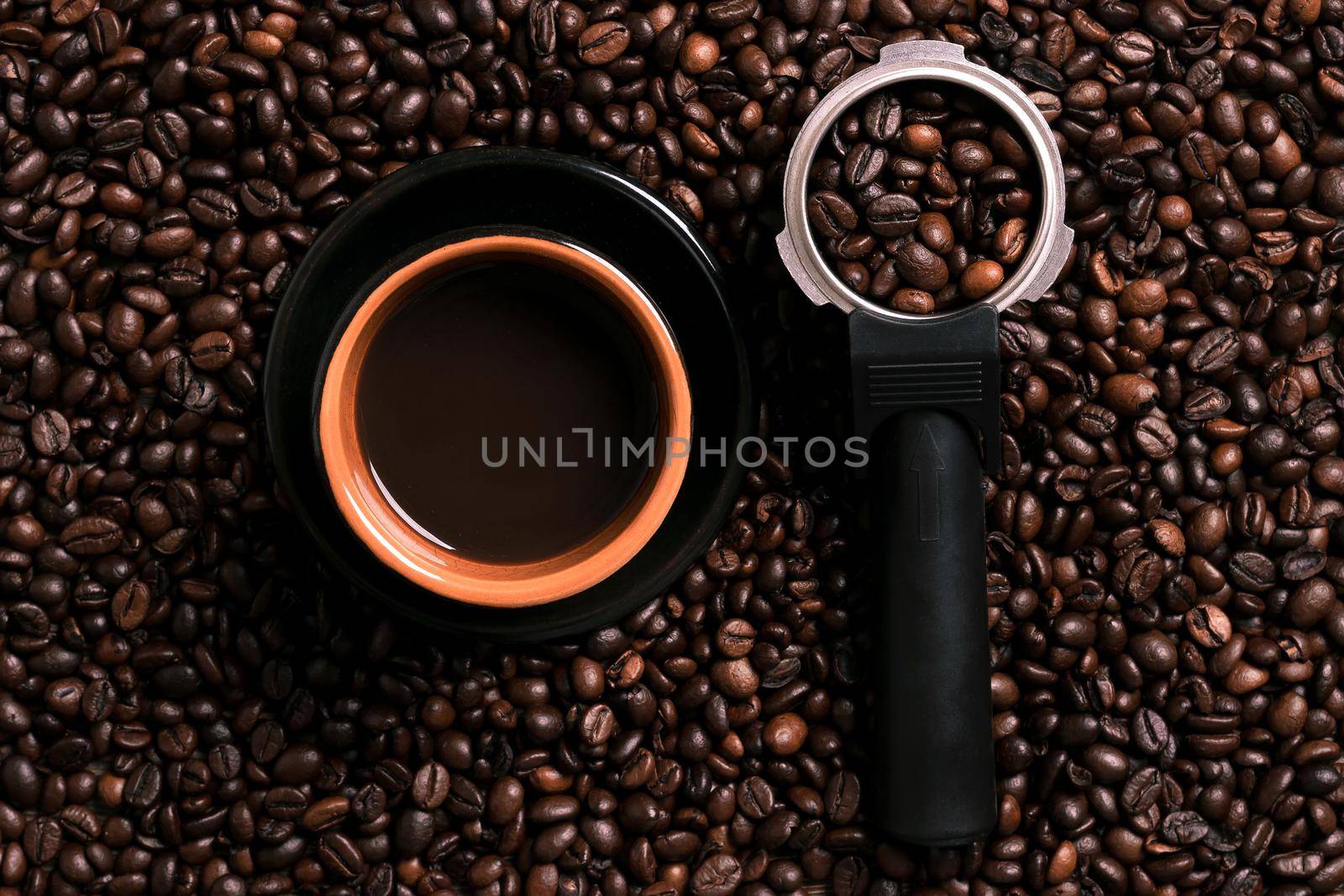 A cup of black coffee with coffee bean as background. Top view. Copy space. Still life. Mock-up. Flat lay