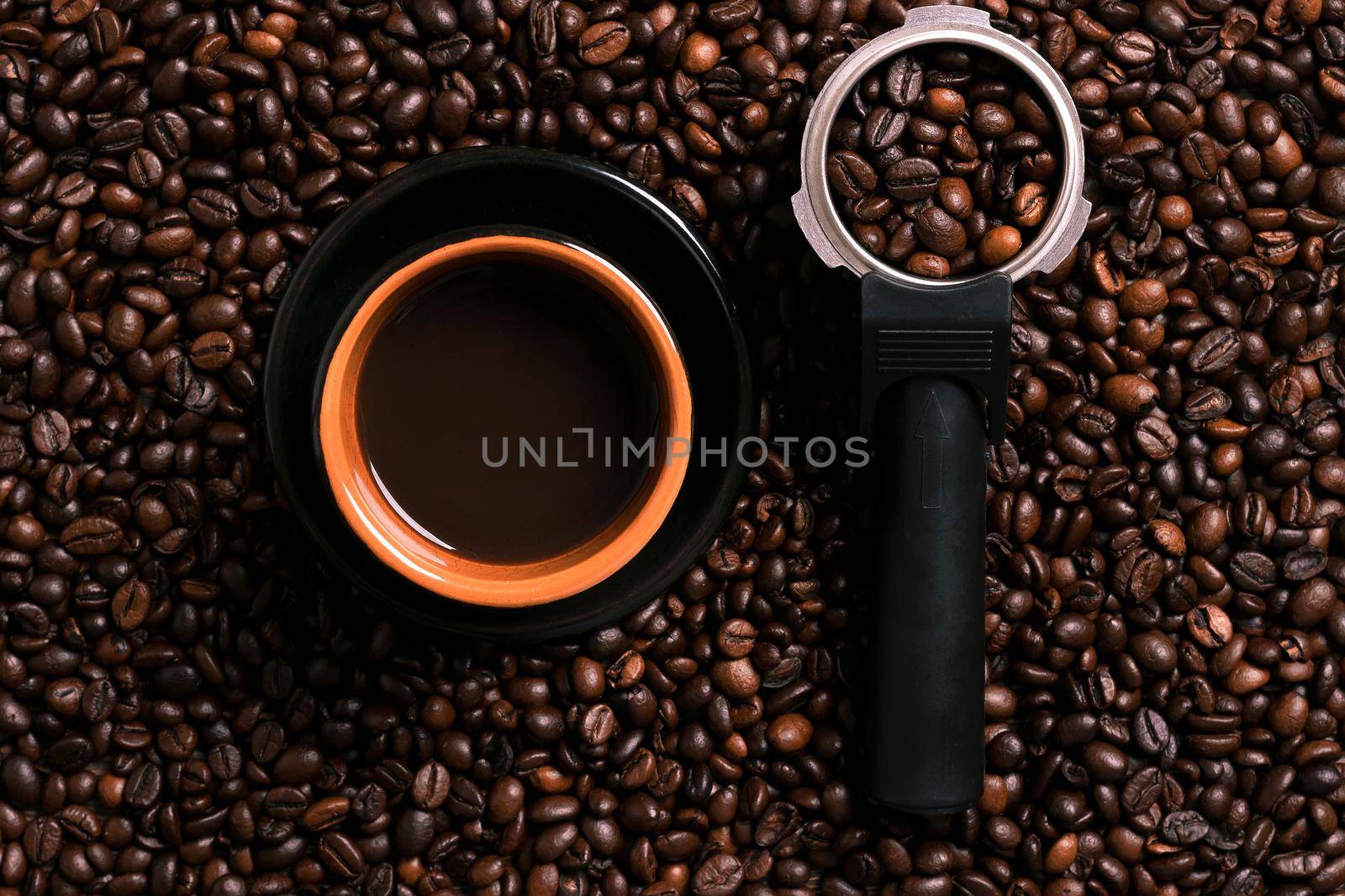 A cup of black coffee with coffee bean as background. Top view. Copy space. Still life. Mock-up. Flat lay