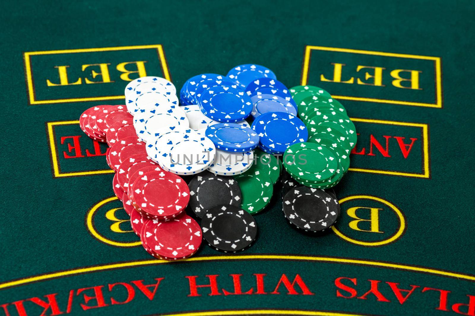 Poker play. Chips on the green table