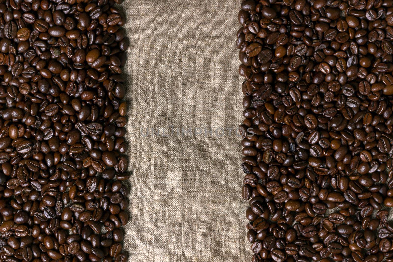 Coffee beans on burlap background. Top view. Copy space. Still life. Mock-up. Flat lay