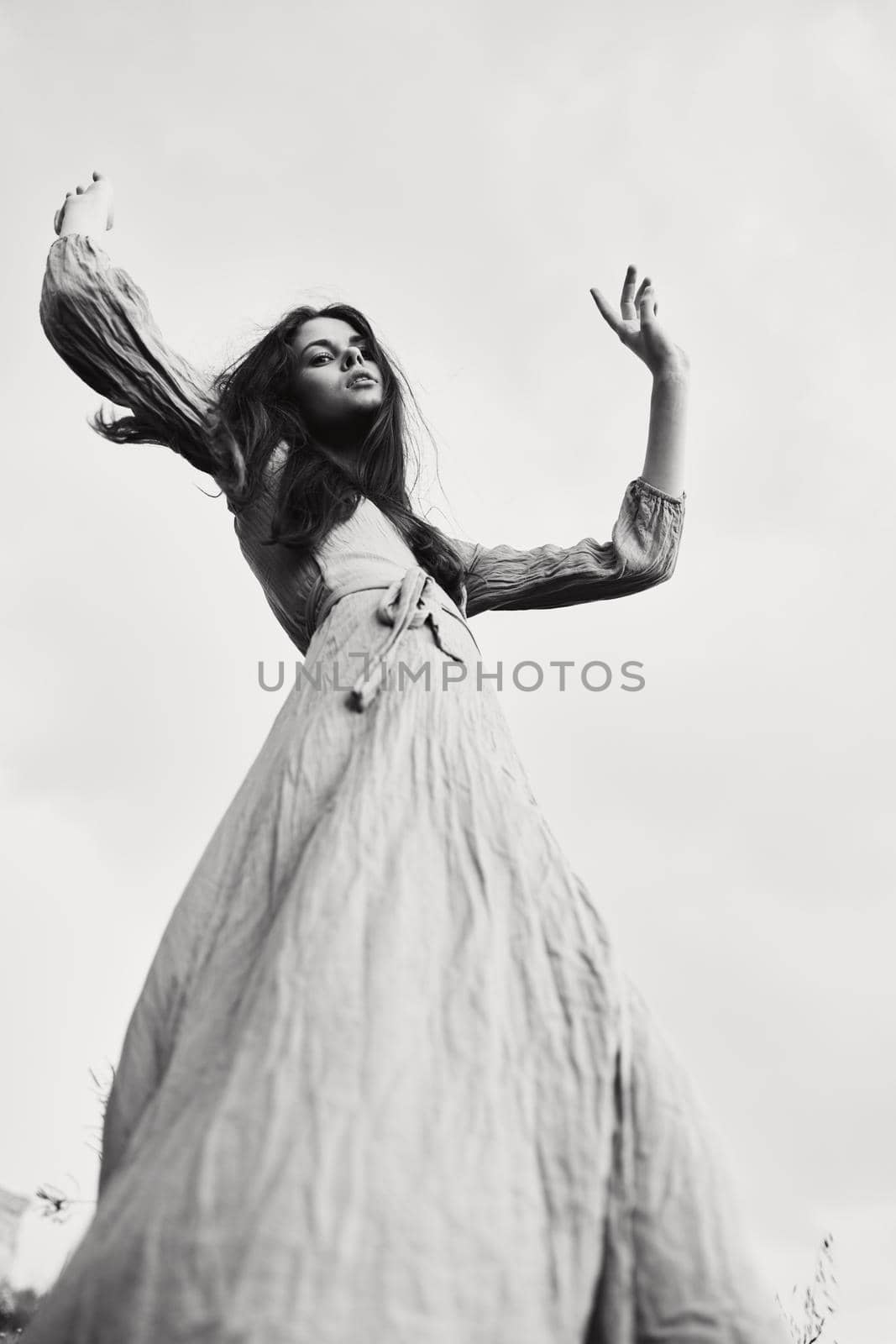 woman in dress gesturing with hands posing Lifestyle. High quality photo