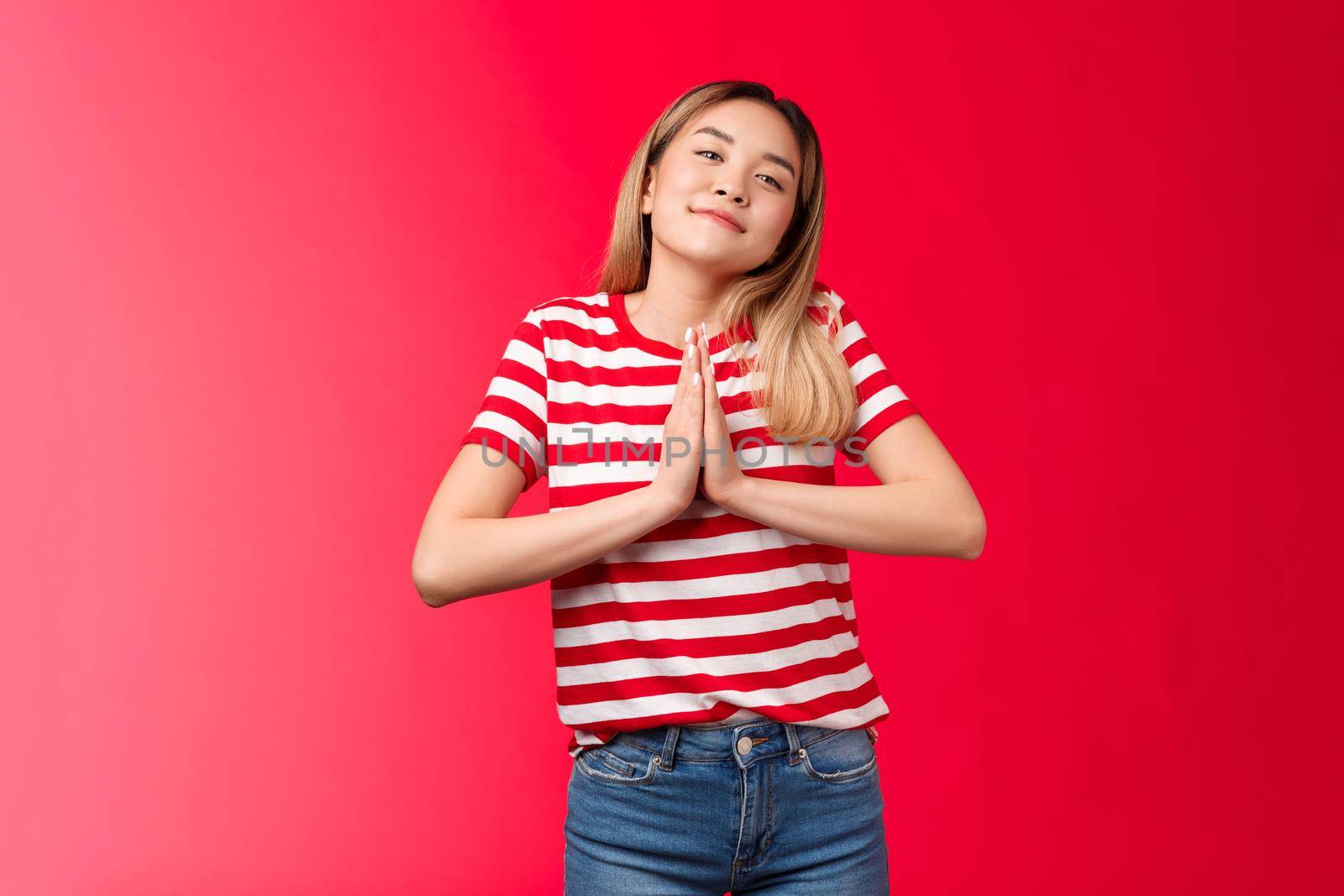 Pretty please lend me car. Cute clingy silly asian blond girl hold hands pray, tilt head smiling tender camera, asking favour, supplicating, pleading friend help stand red background act like angel by Benzoix