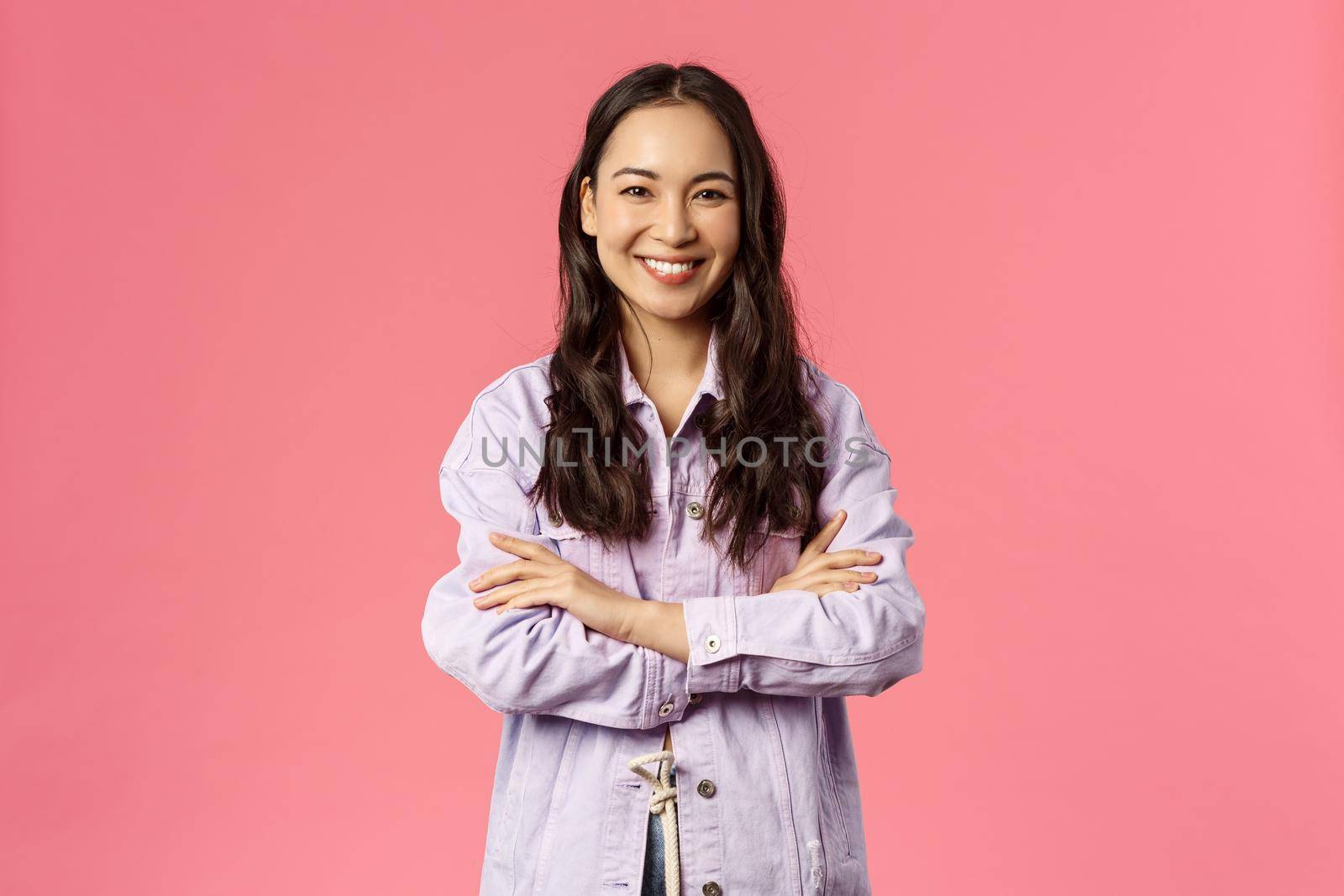 I am ready, lets do it. Enthusiastic attractive korean girl in denim jacket, cross hands chest and smiling assertive, feeling happy and confident, searching career opportunities, pink background.
