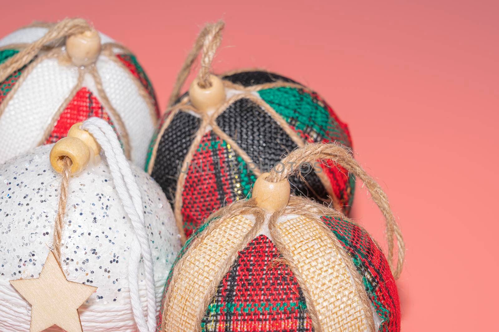 Christmas balls on a pink background close-up by roman112007