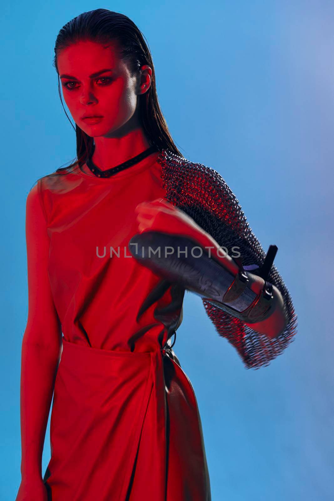 attractive woman in dress arm in armor chain mail protection Lifestyle unaltered. High quality photo