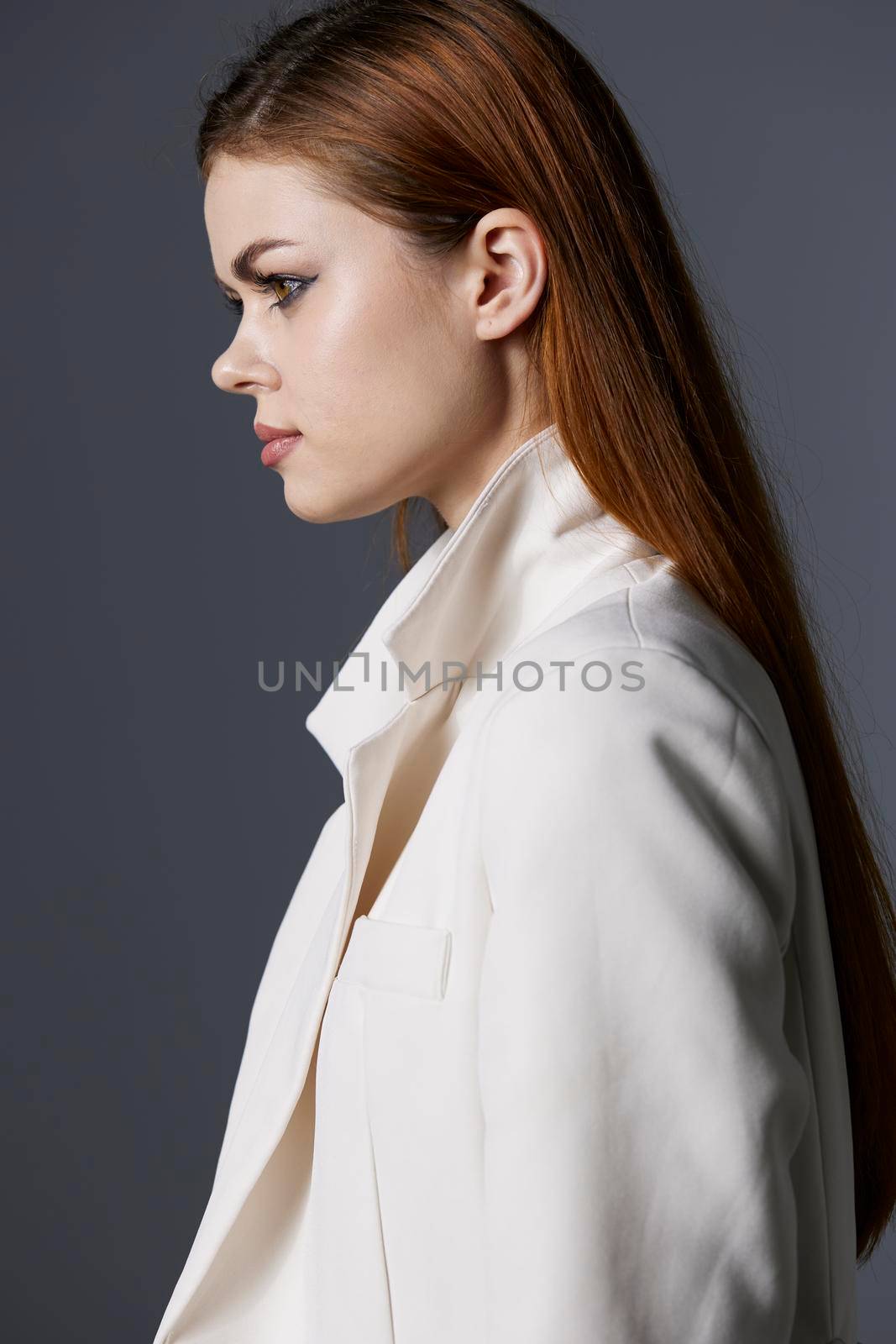 young woman luxury model in white coat unaltered. High quality photo