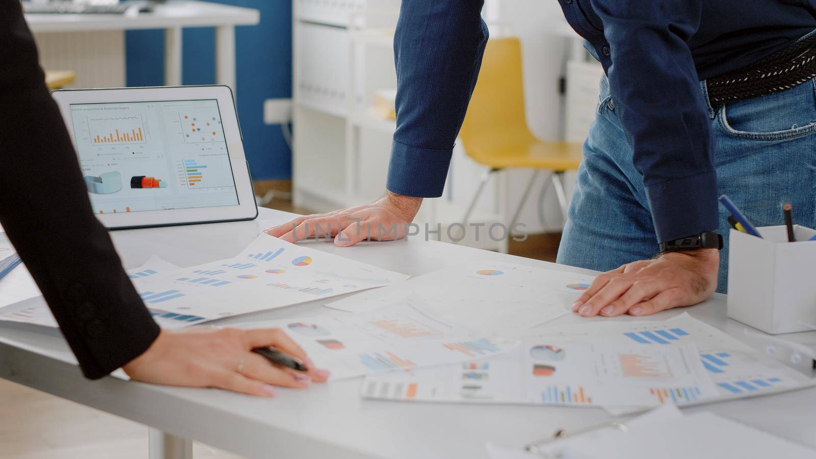 Close up of analysis documents with data charts on desk by DCStudio