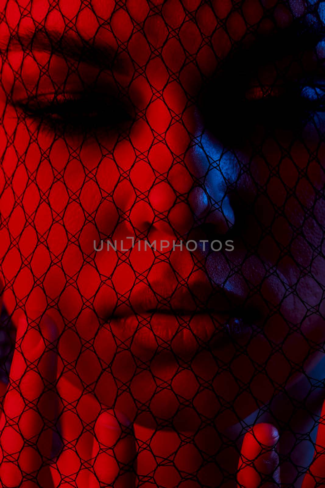 young woman posing mesh on the face neon Lifestyle unaltered. High quality photo