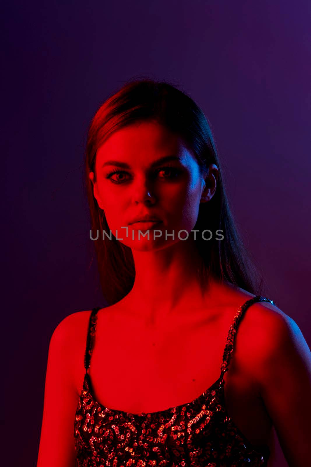 young woman fashion posing red light Lifestyle unaltered. High quality photo