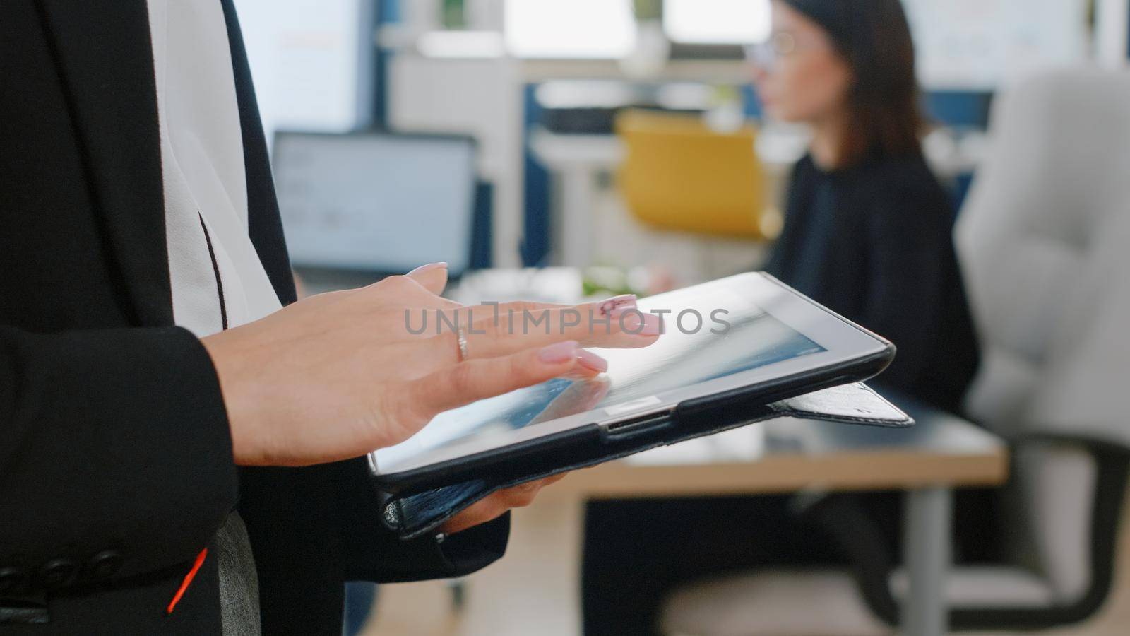 Close up of woman holding digital tablet with touch screen by DCStudio