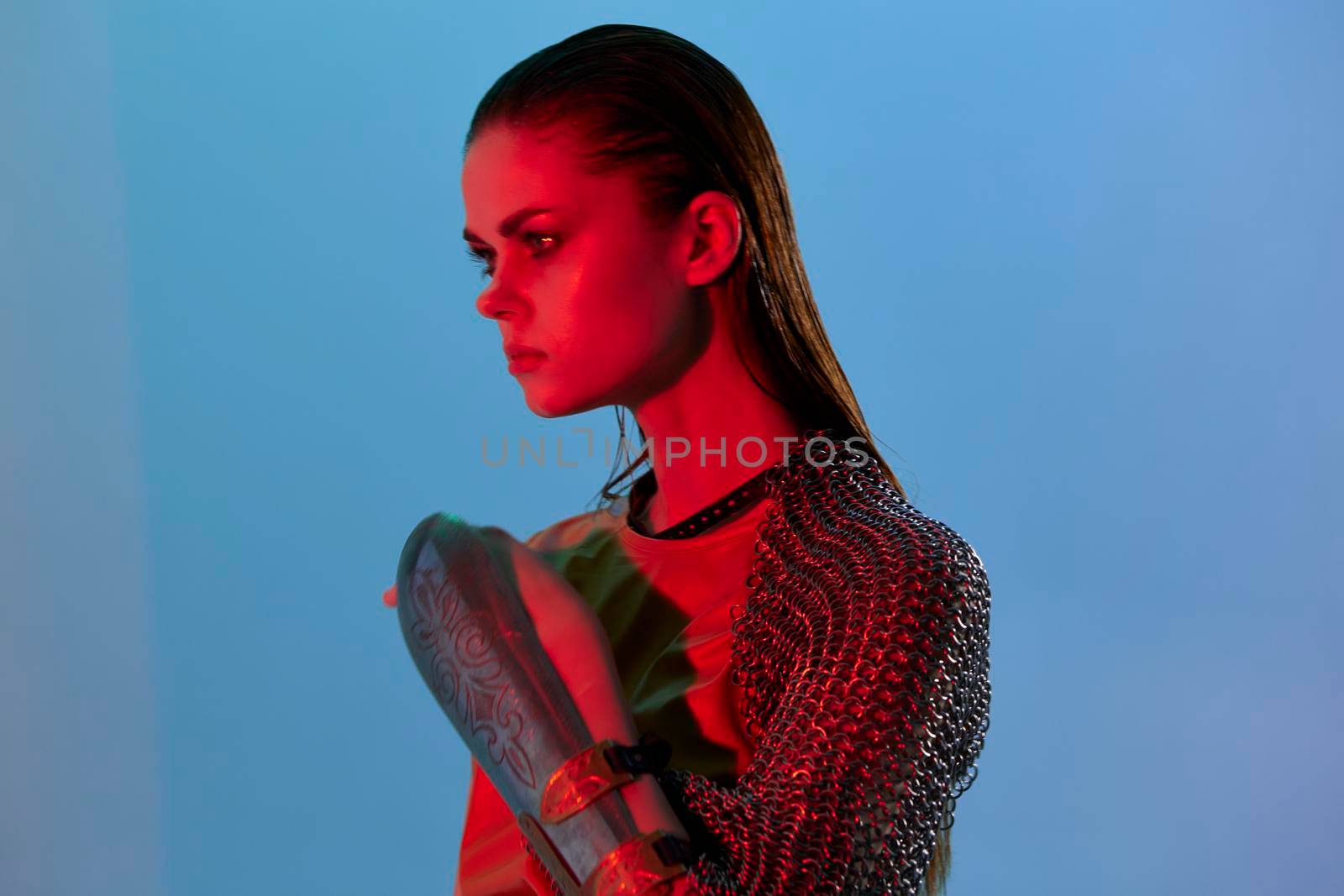 photo pretty woman in dress arm in armor chain mail protection Lifestyle unaltered. High quality photo