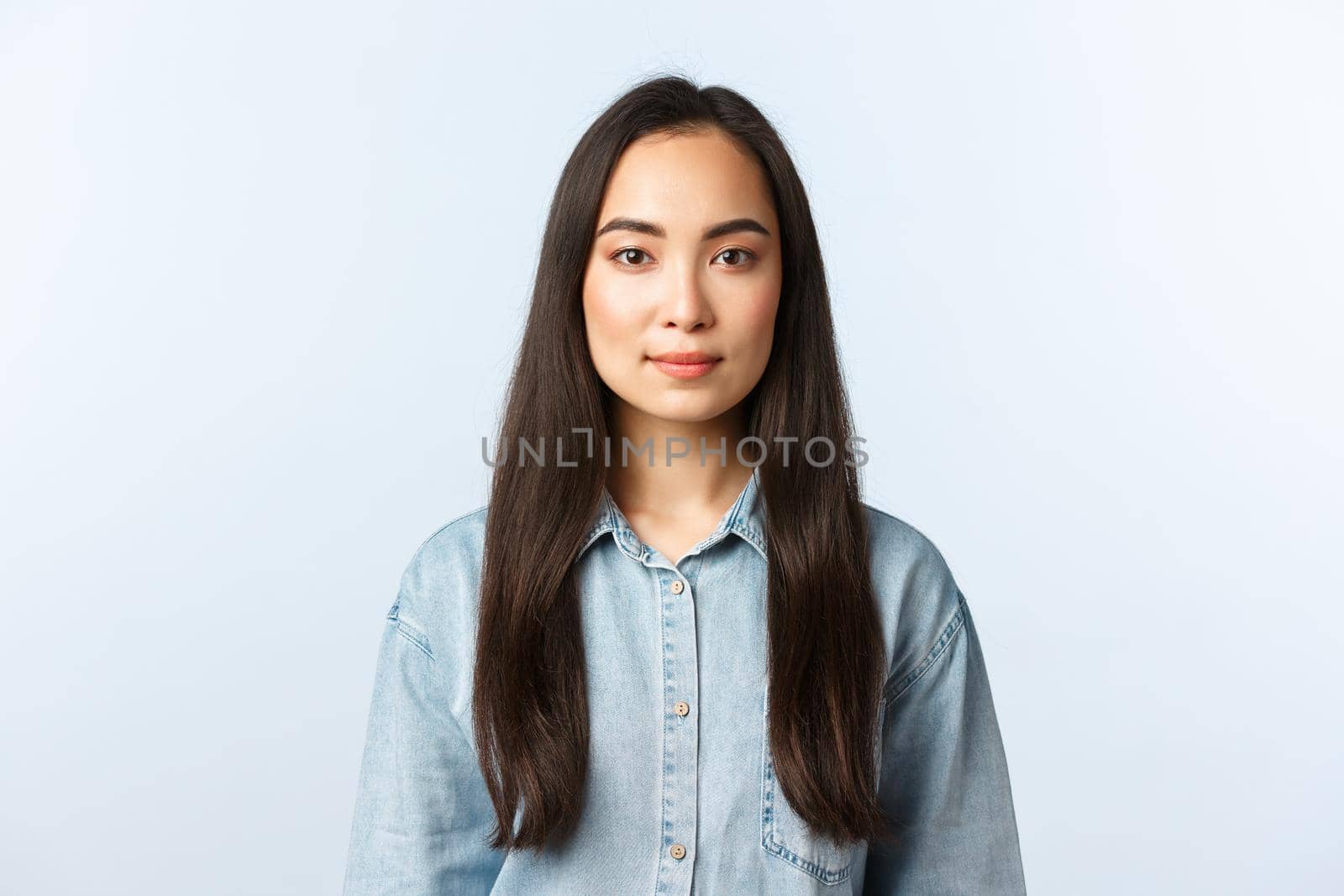 Lifestyle, people emotions and beauty concept. Young woman with long dark hair looking camera with smile. Confident female student starting part-time job feeling determined by Benzoix