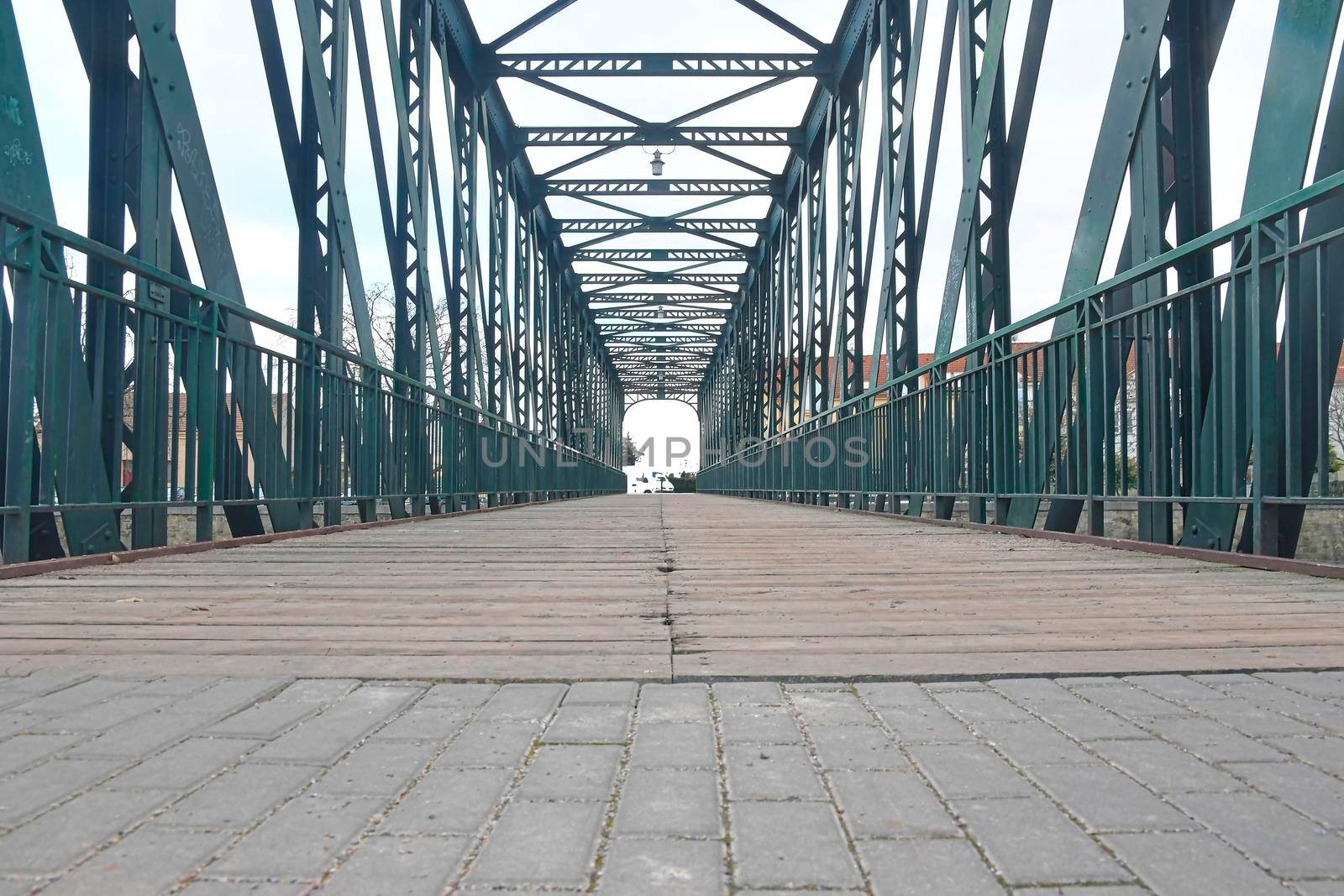 Old metal overpass, bridge over the river. Rivet metal bridge in town. Breclav, Czechia by roman_nerud