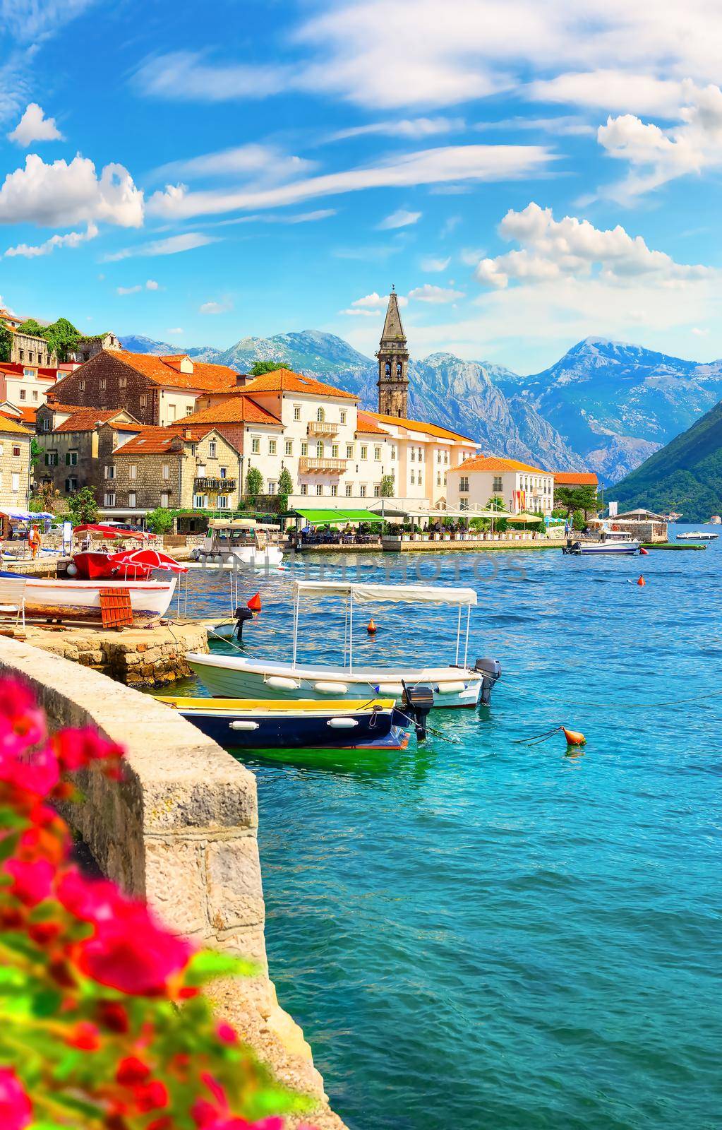 Famous Perast bell tower in sunny summer day