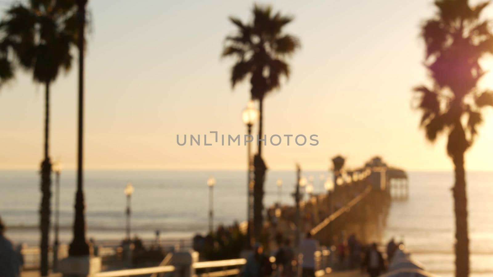 People walking, wooden pier in California USA. Oceanside waterfront vacations tourist resort. by DogoraSun
