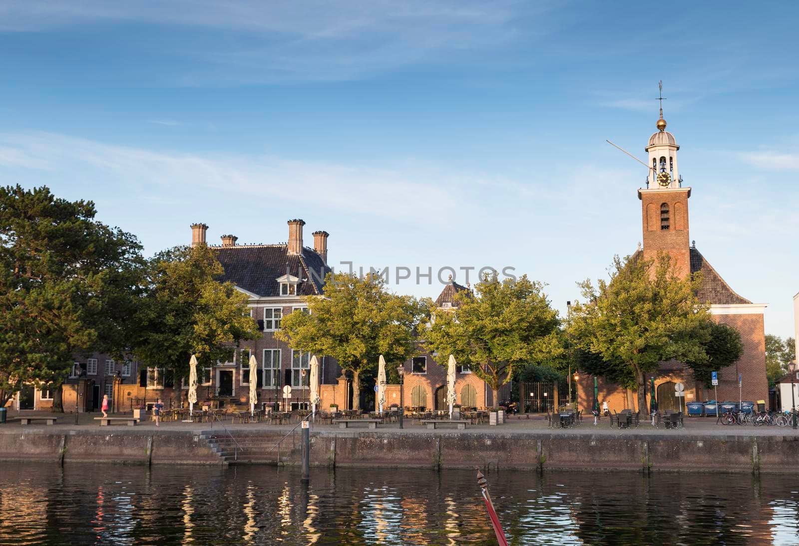 Hellevoetlsuis,Holland,02-08-2021:city view with harbour and church Vestingkerk in Hellevoetsluis at dusk, South Holland, Netherlands