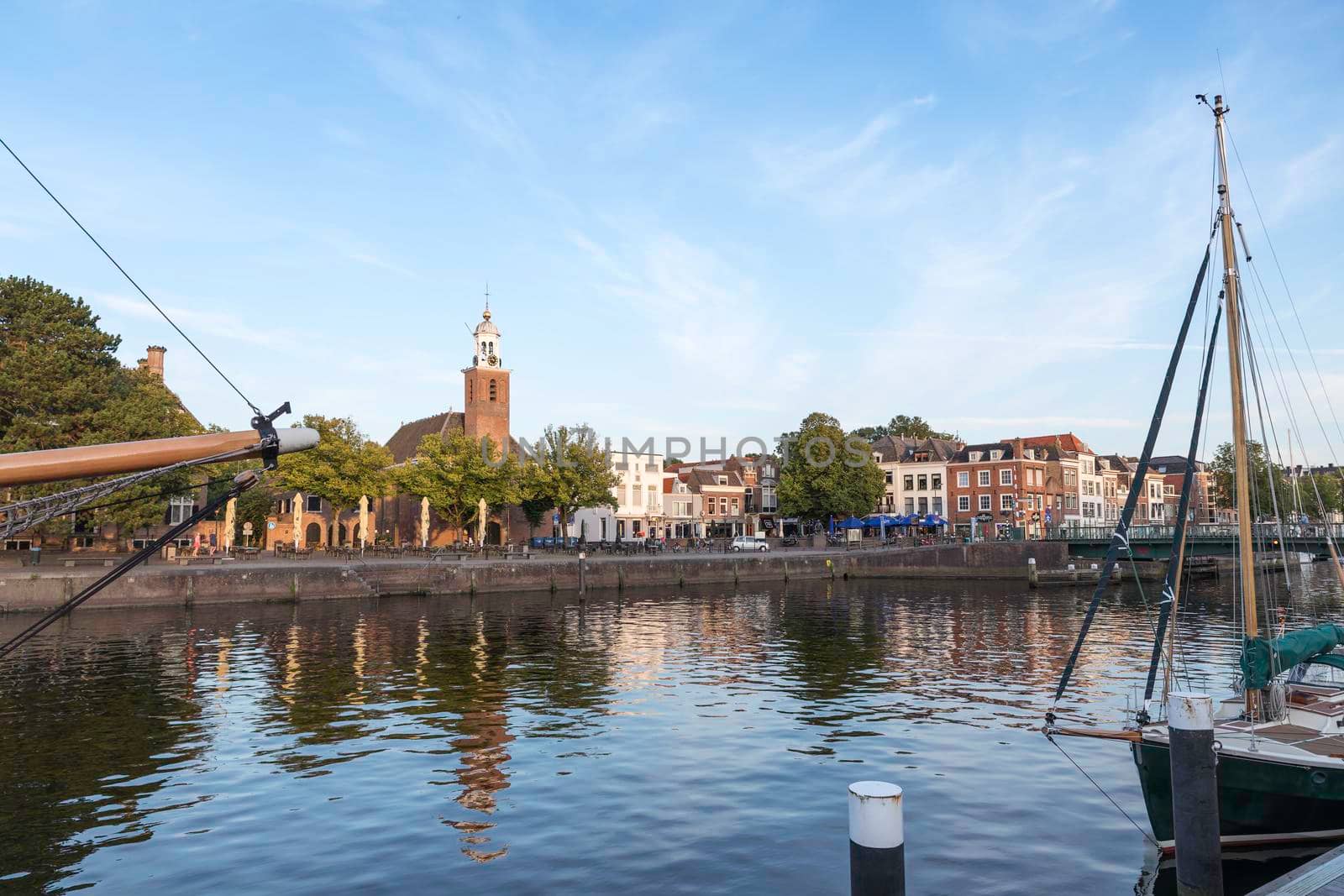 city view with harbour and church Vestingkerk in Hellevoetsluis at dusk, South Holland, Netherlands by compuinfoto