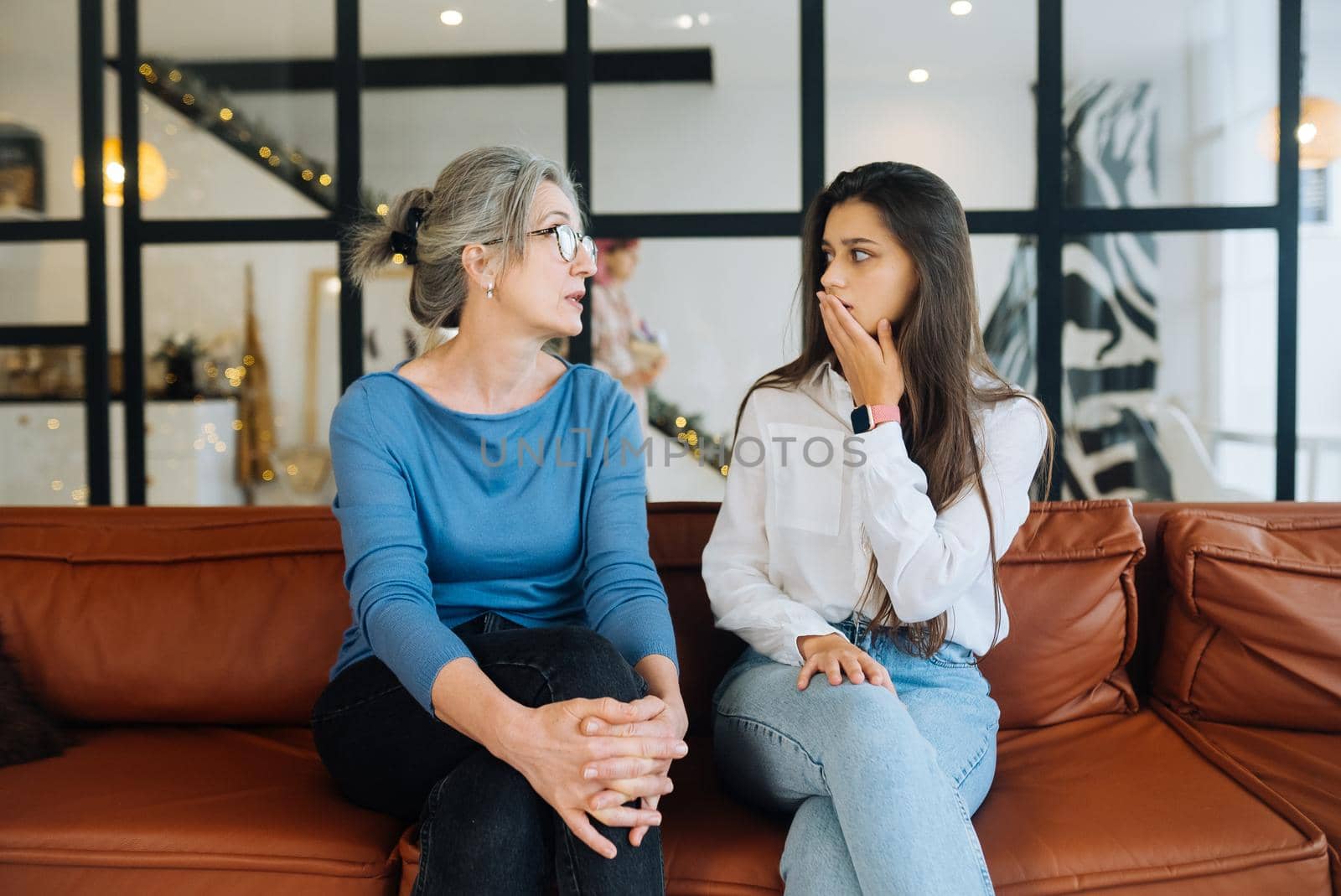 Young woman visiting grandmother at home