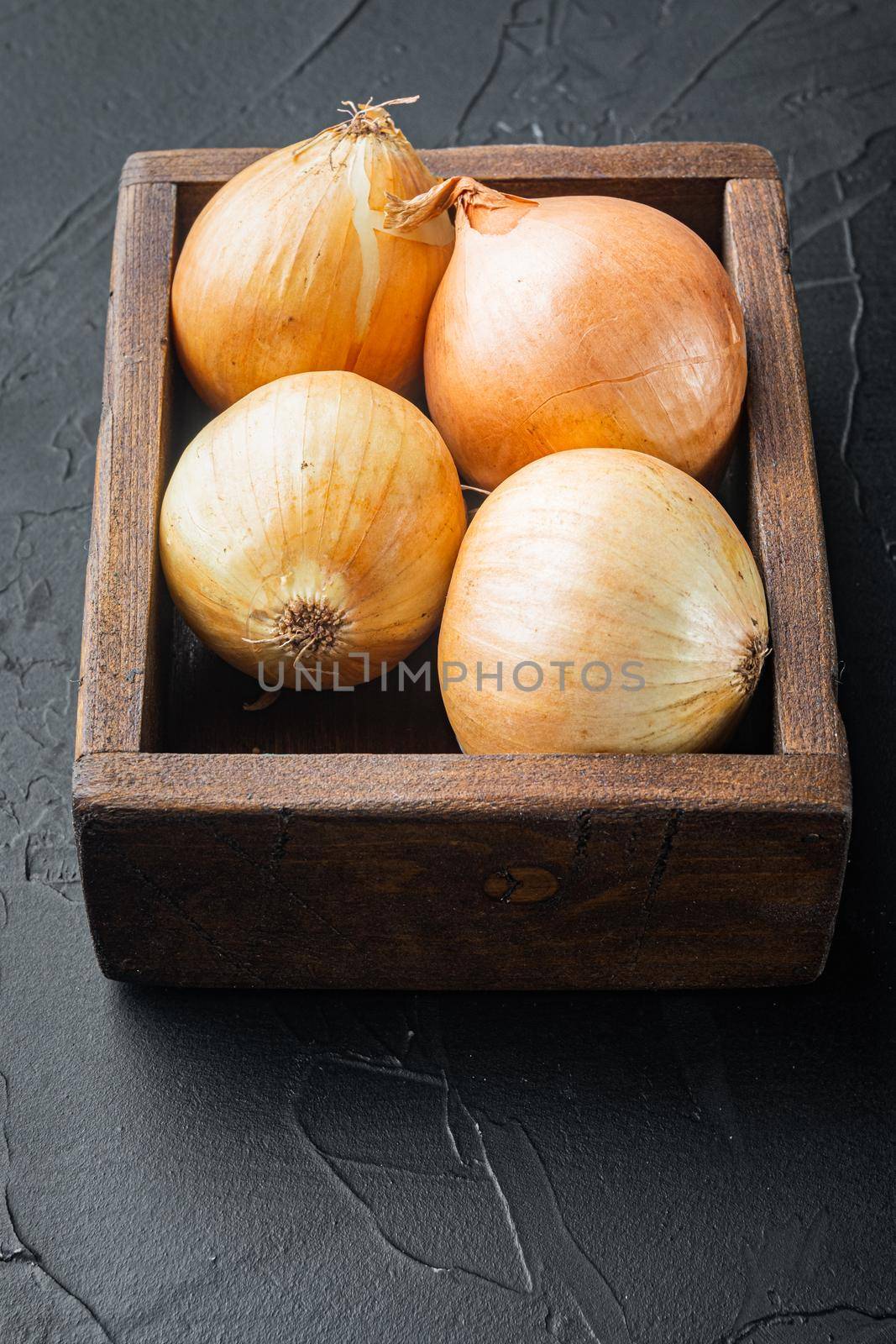 Fresh onions, on black background