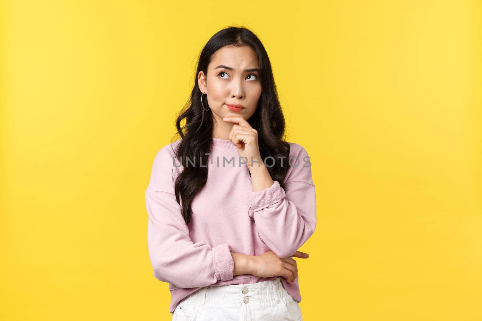 People emotions, lifestyle and fashion concept. Serious-looking complicated asian woman thinking, frowning and looking top left corner with thoughtful expression, making choice by Benzoix