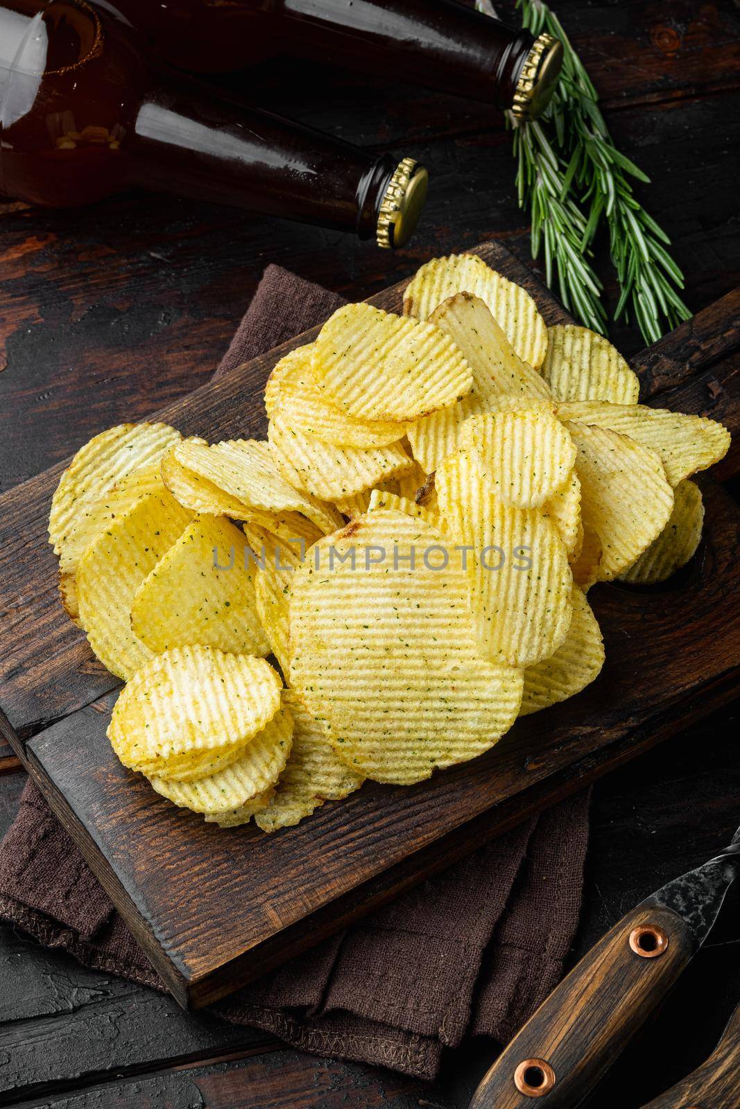 Salty potato chips snack set, on old dark wooden table