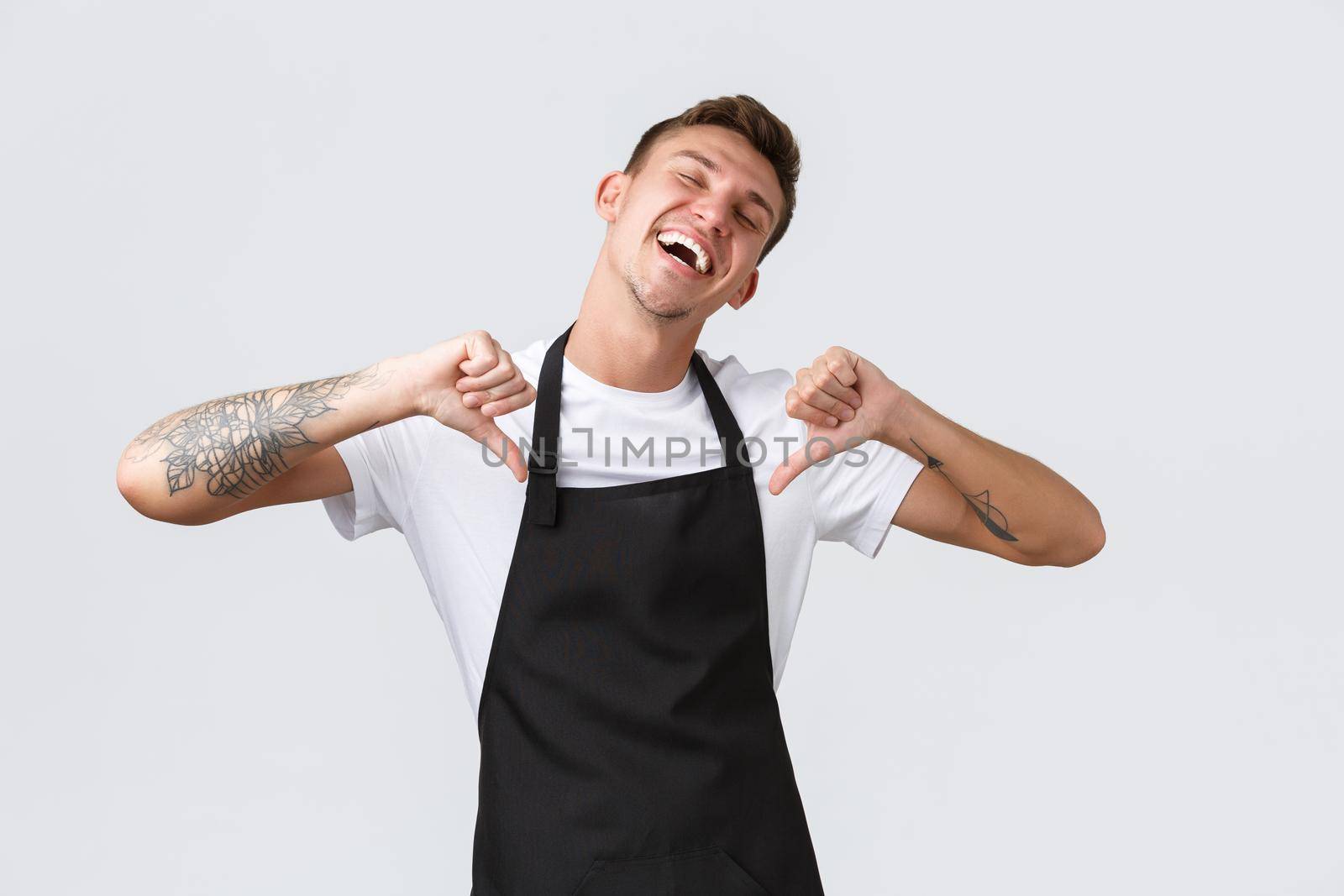 Employees, grocery stores and coffee shop concept. Handsome happy and pleased barista, waiter become employee of month, pointing at himself proud and delighted, white background.