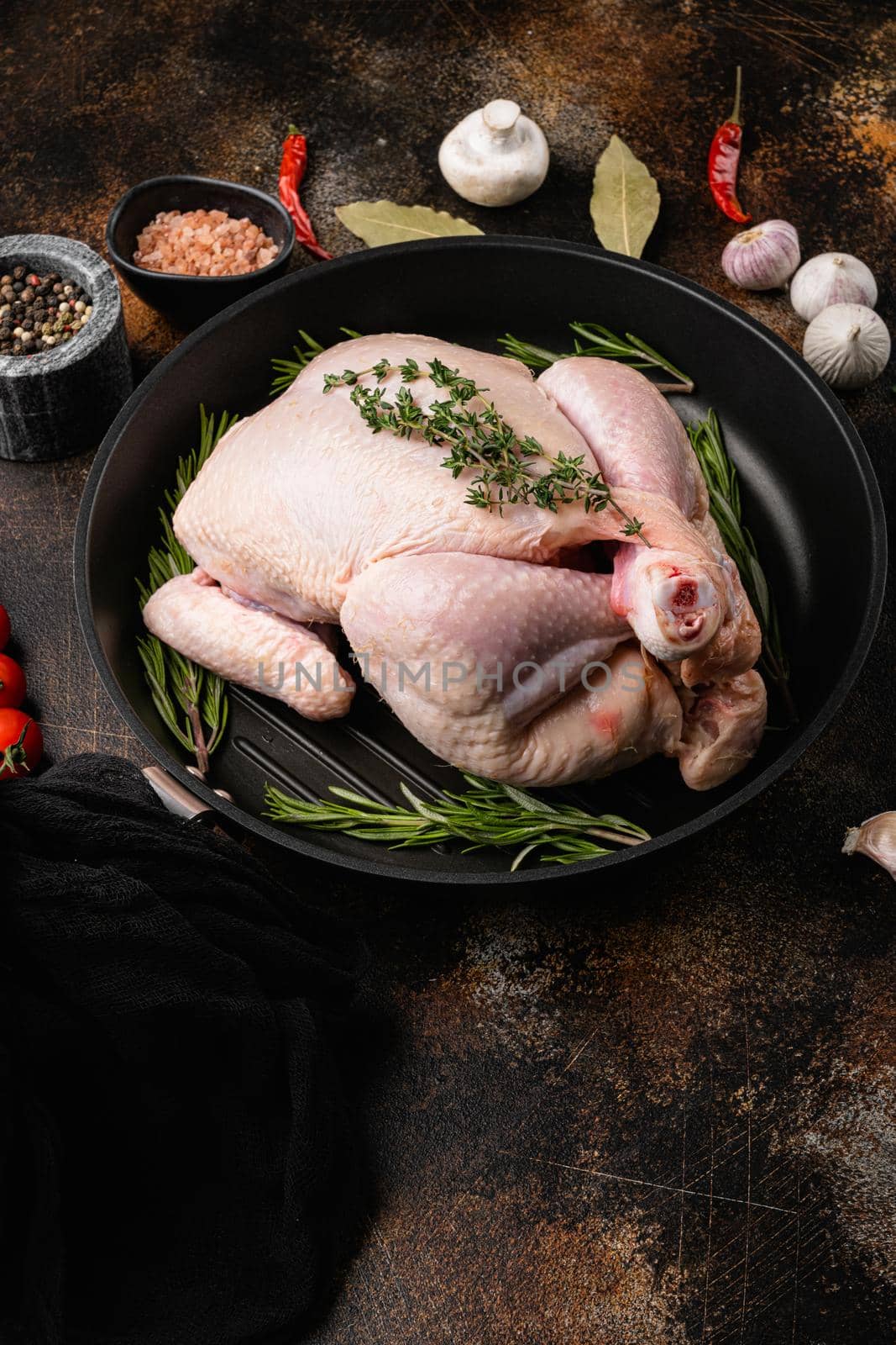Raw chicken set, on old dark rustic table background, with copy space for text