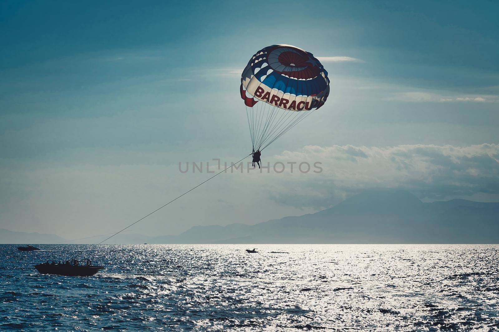 Parachute over the sea, resort water activities. Extreme vacation by the sea