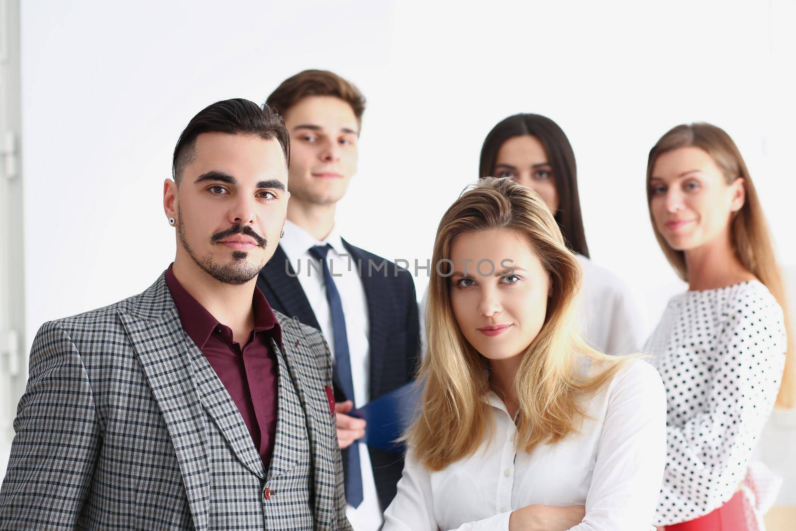 Portrait of smart confident team of successful people, coworkers pose for collective picture. Clever employees in suits. Business, teamwork, career concept