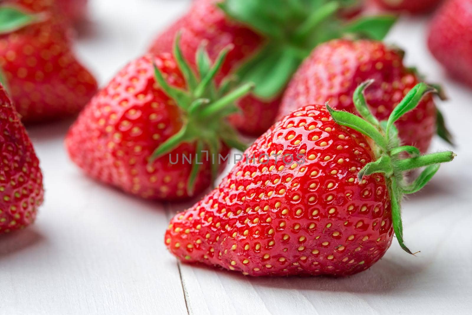 Fresh strawberry background. Ripe in close-up. by nazarovsergey