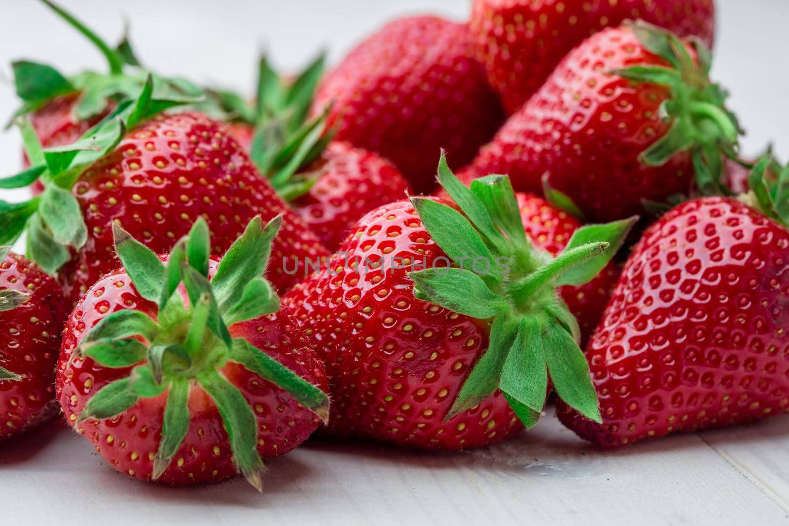 Fresh strawberry background. Ripe in close-up. by nazarovsergey