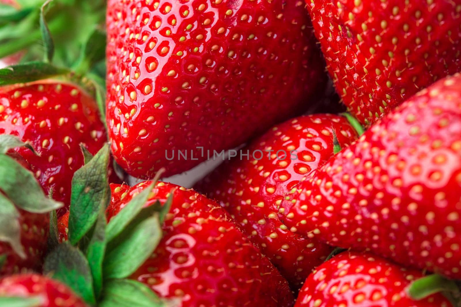 Fresh strawberry background. Ripe in close-up. by nazarovsergey