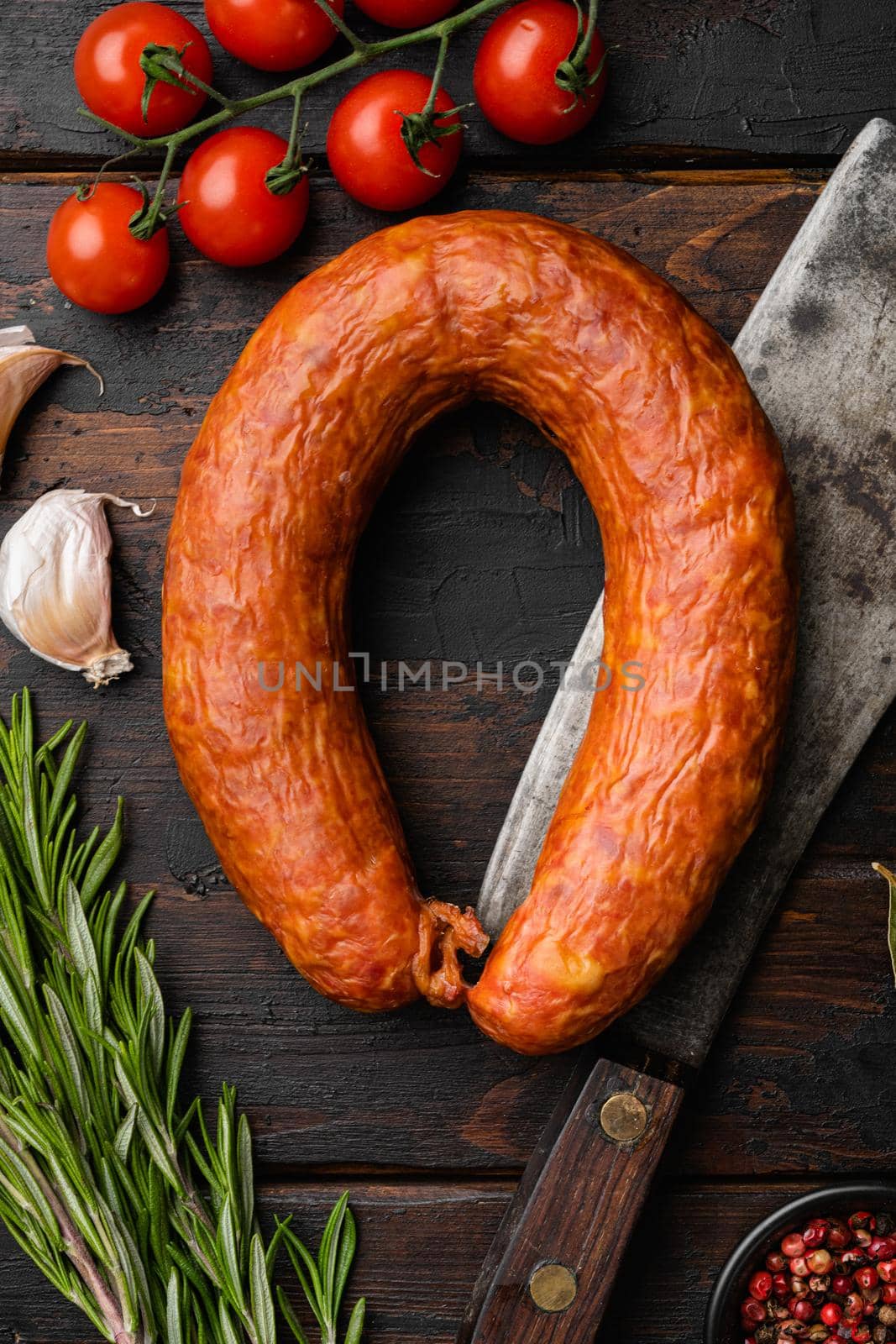 Spanish smoked sausage set, on old dark wooden table background, top view flat lay