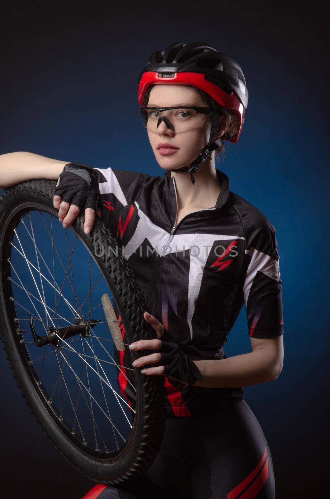 a girl cyclist in a helmet by Rotozey