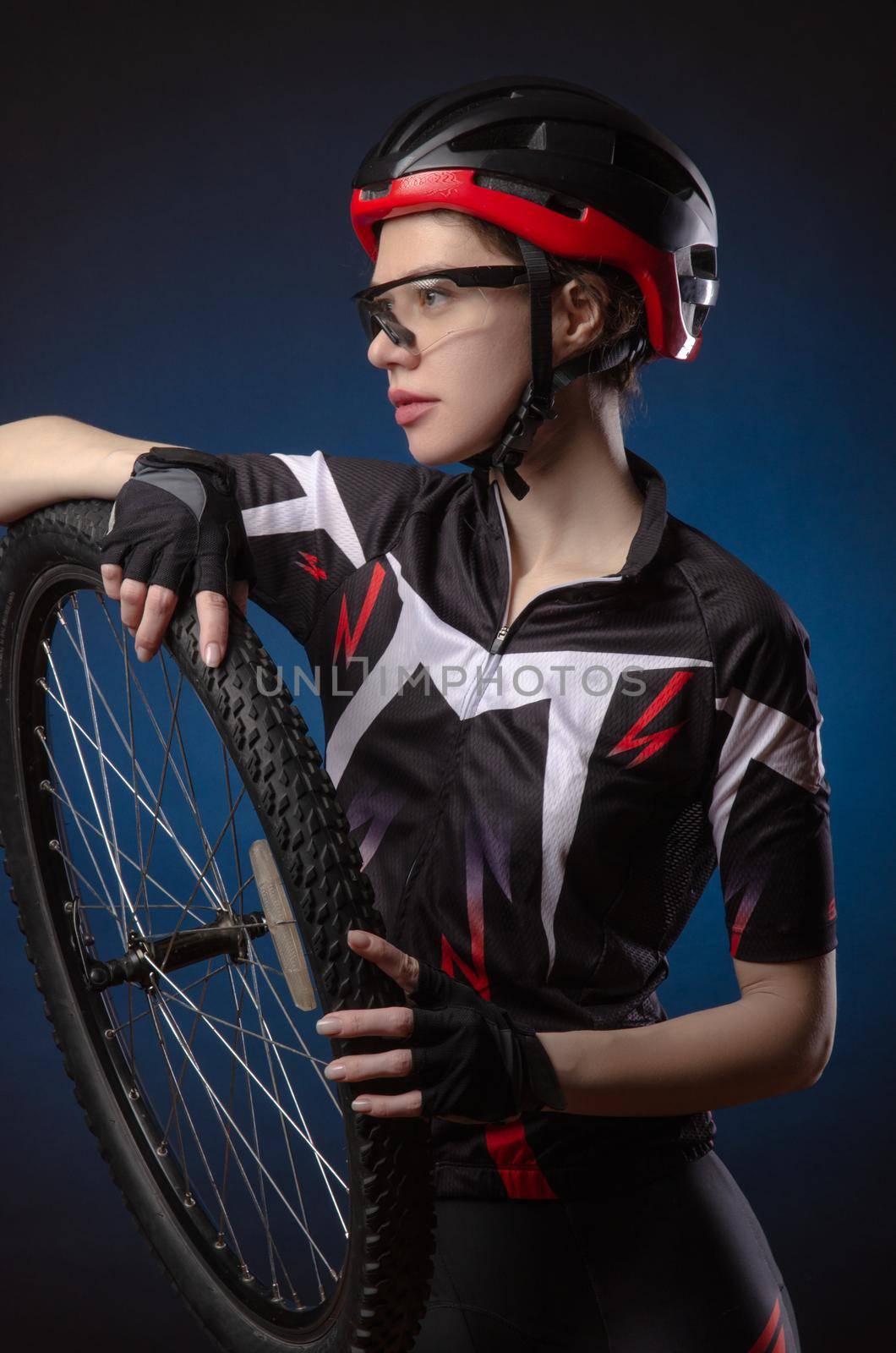 a girl cyclist in a helmet by Rotozey