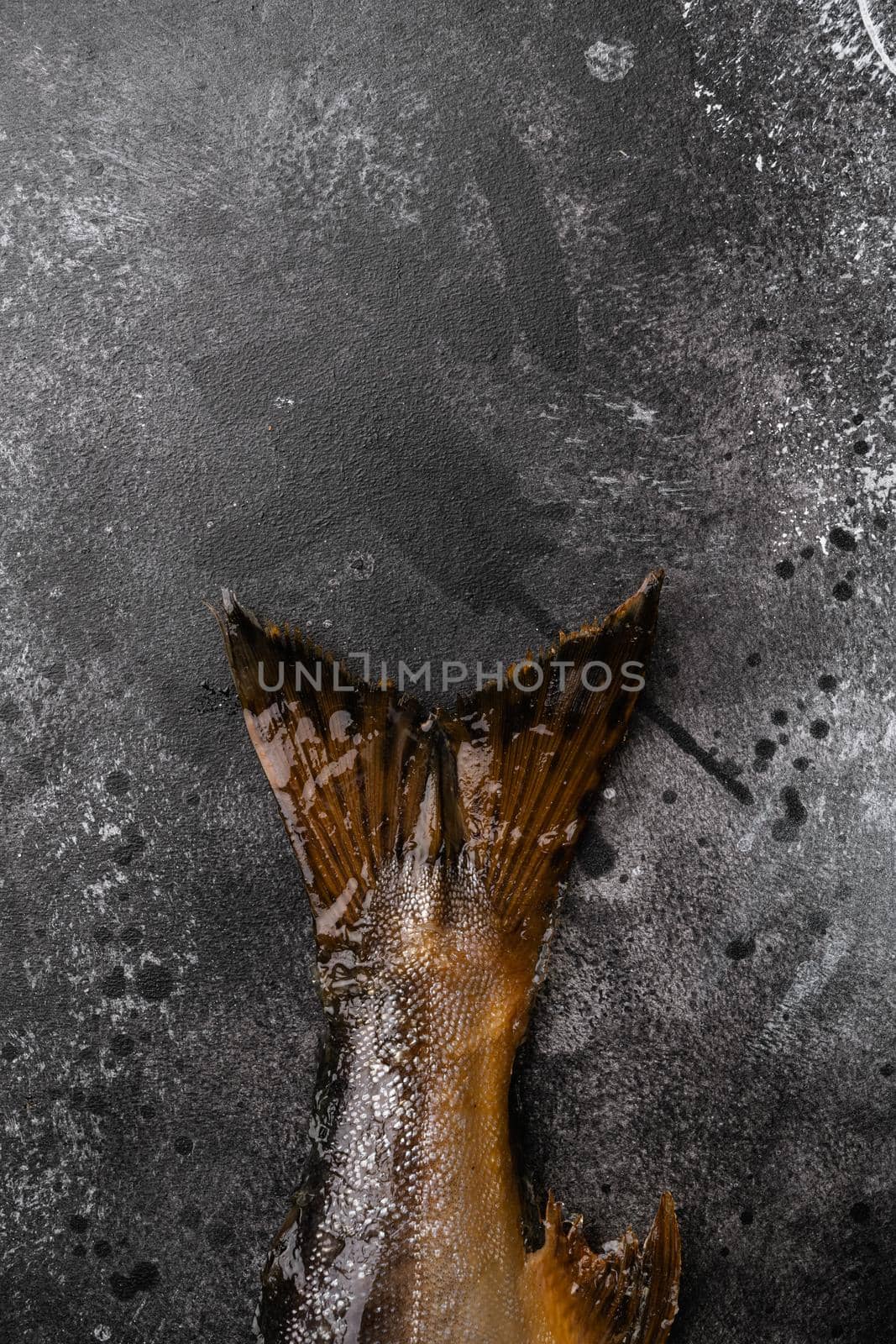 Fresh smoked salmon, on black dark stone table background, top view flat lay, with copy space for text by Ilianesolenyi