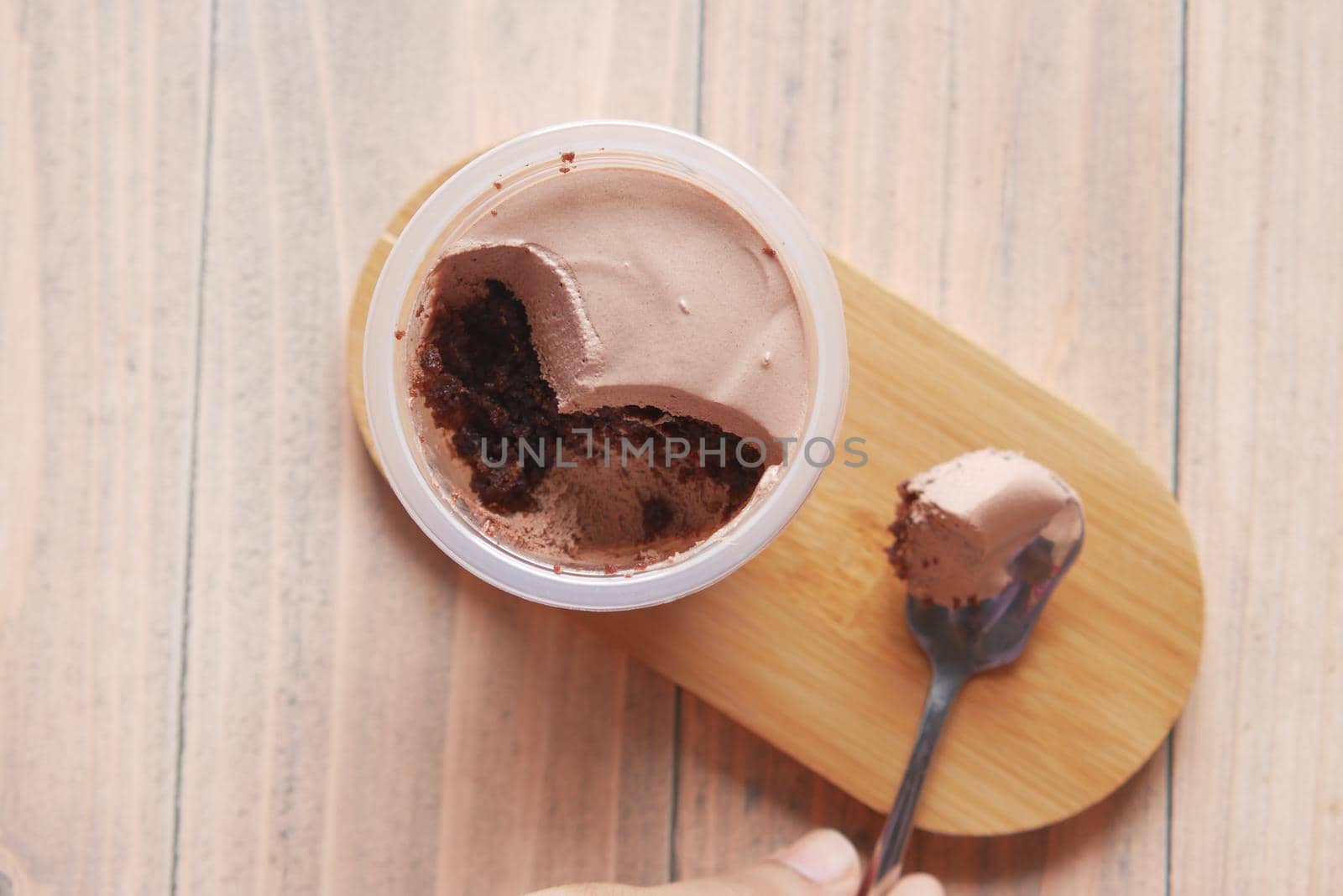Mousse cake in a container on table .