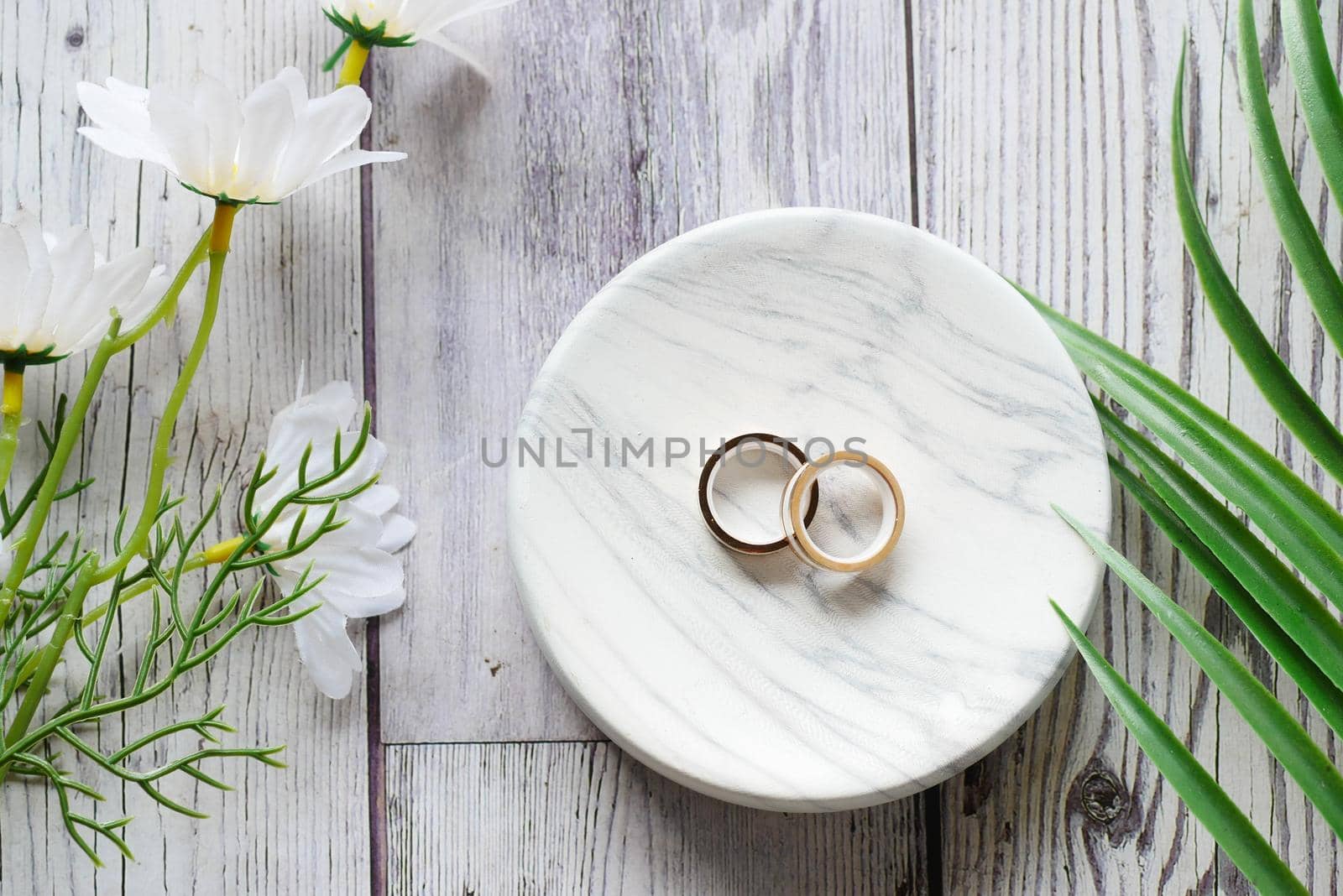 wedding ring in a box on red background