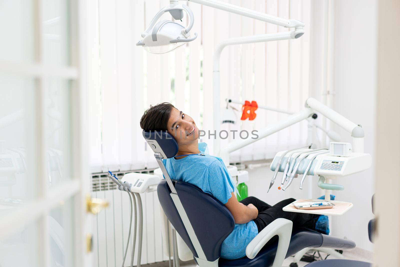 Visiting friendly and professional dentist. high photo by Zurijeta
