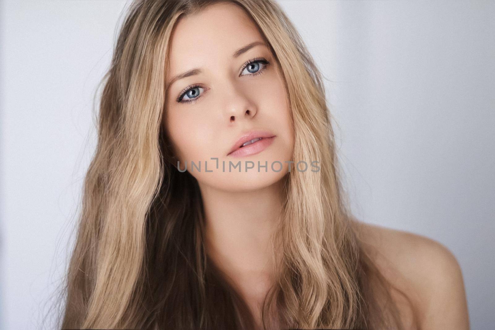 Beauty model look and face portrait. Beautiful woman with blonde hair, long hairstyle and natural makeup as classic closeup for cosmetic and wellness brand.