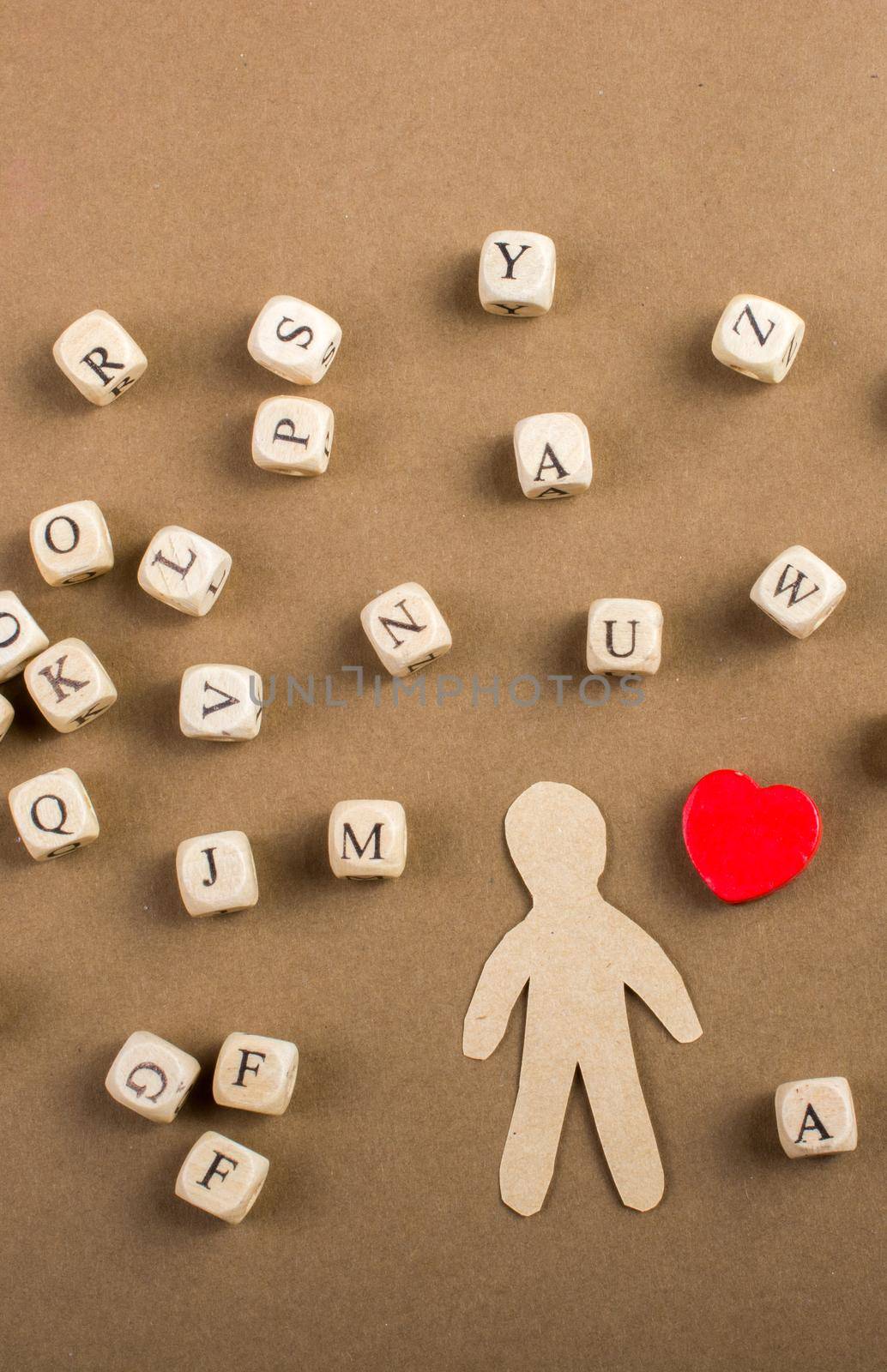 Letter cubes of made of wood  and man figurine and heart shape