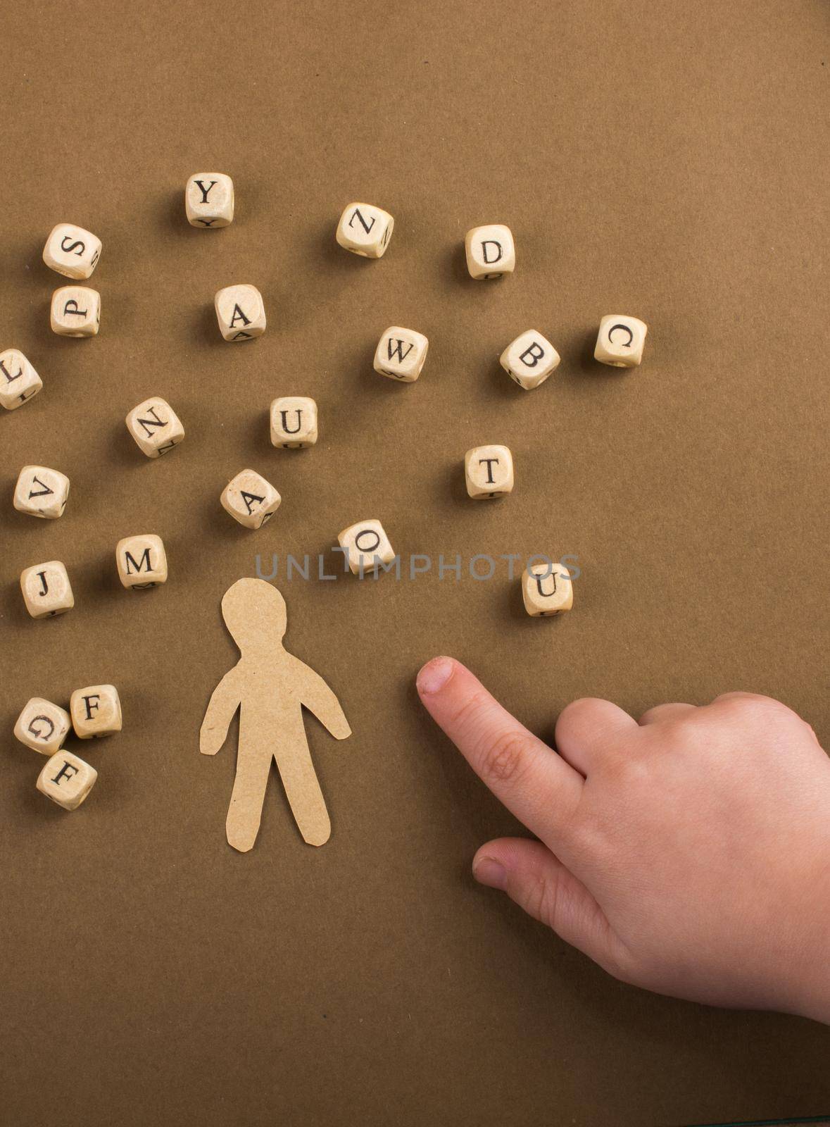Letter cubes of made of wood  and man figurine