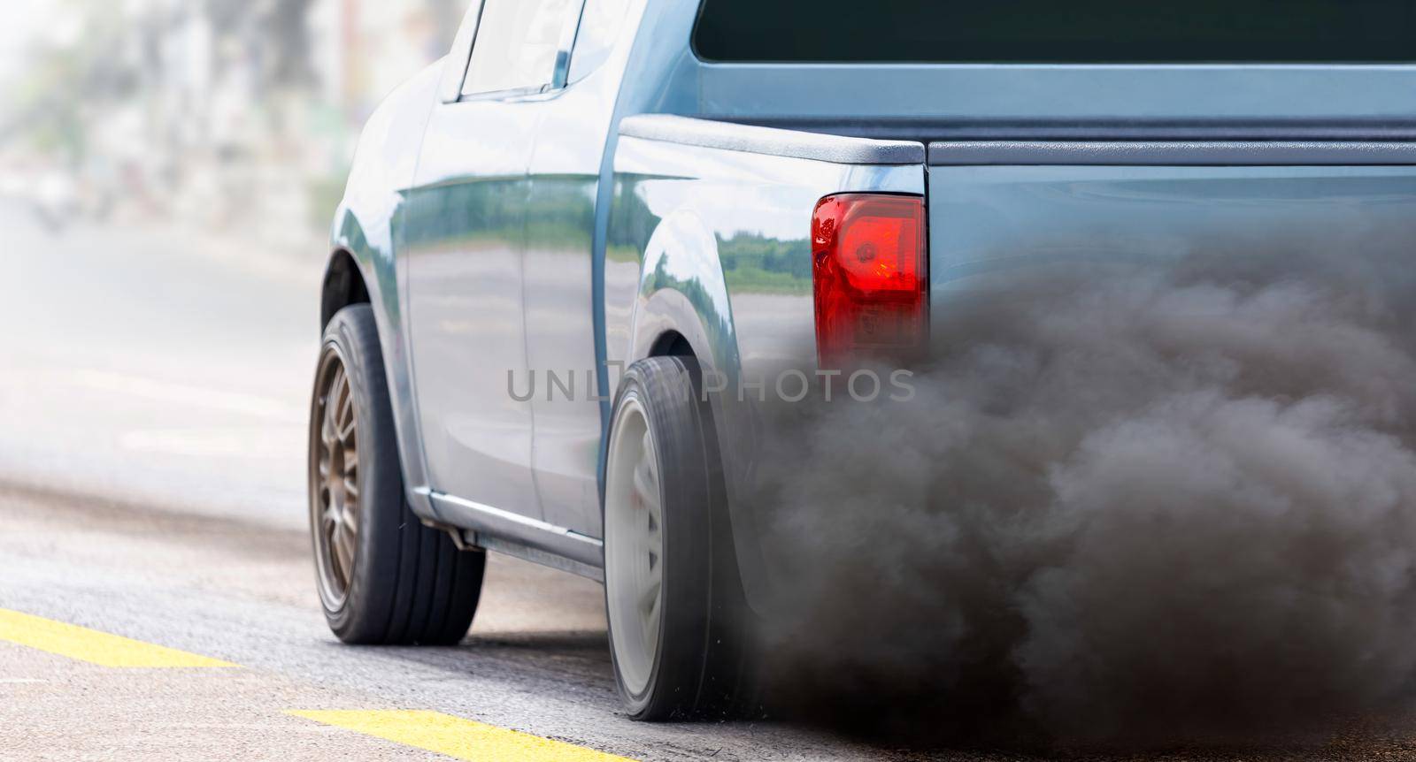 air pollution crisis in city from diesel vehicle exhaust pipe on road   by toa55