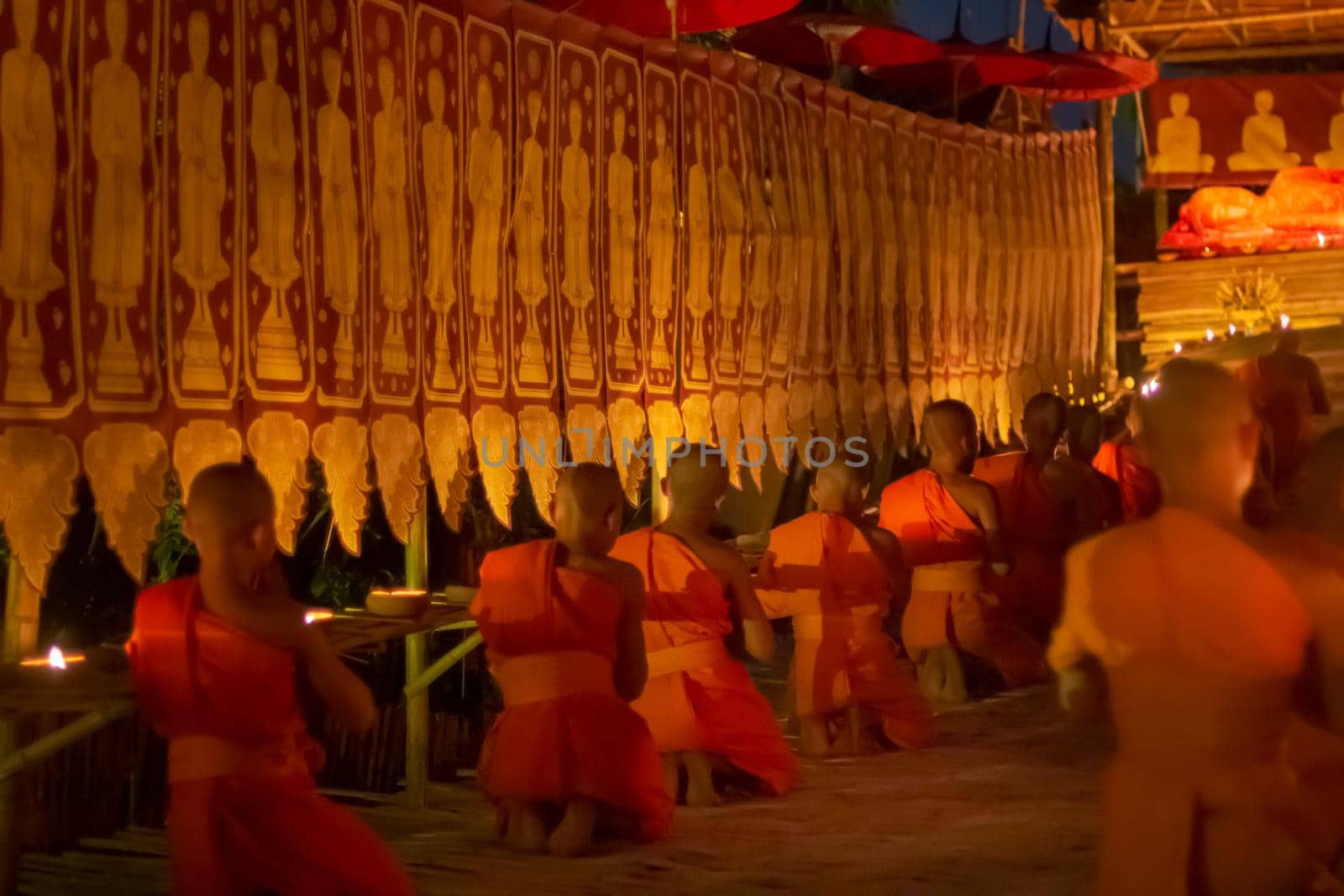 Visakha Puja Day (Vesak). Buddhist monk fire candles and pray to the Buddha in  Chiang Mai Thailand. by toa55