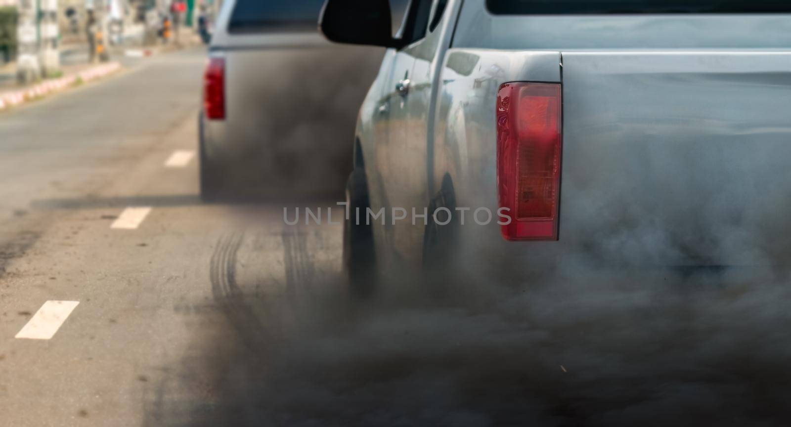 air pollution crisis in city from diesel vehicle exhaust pipe on road